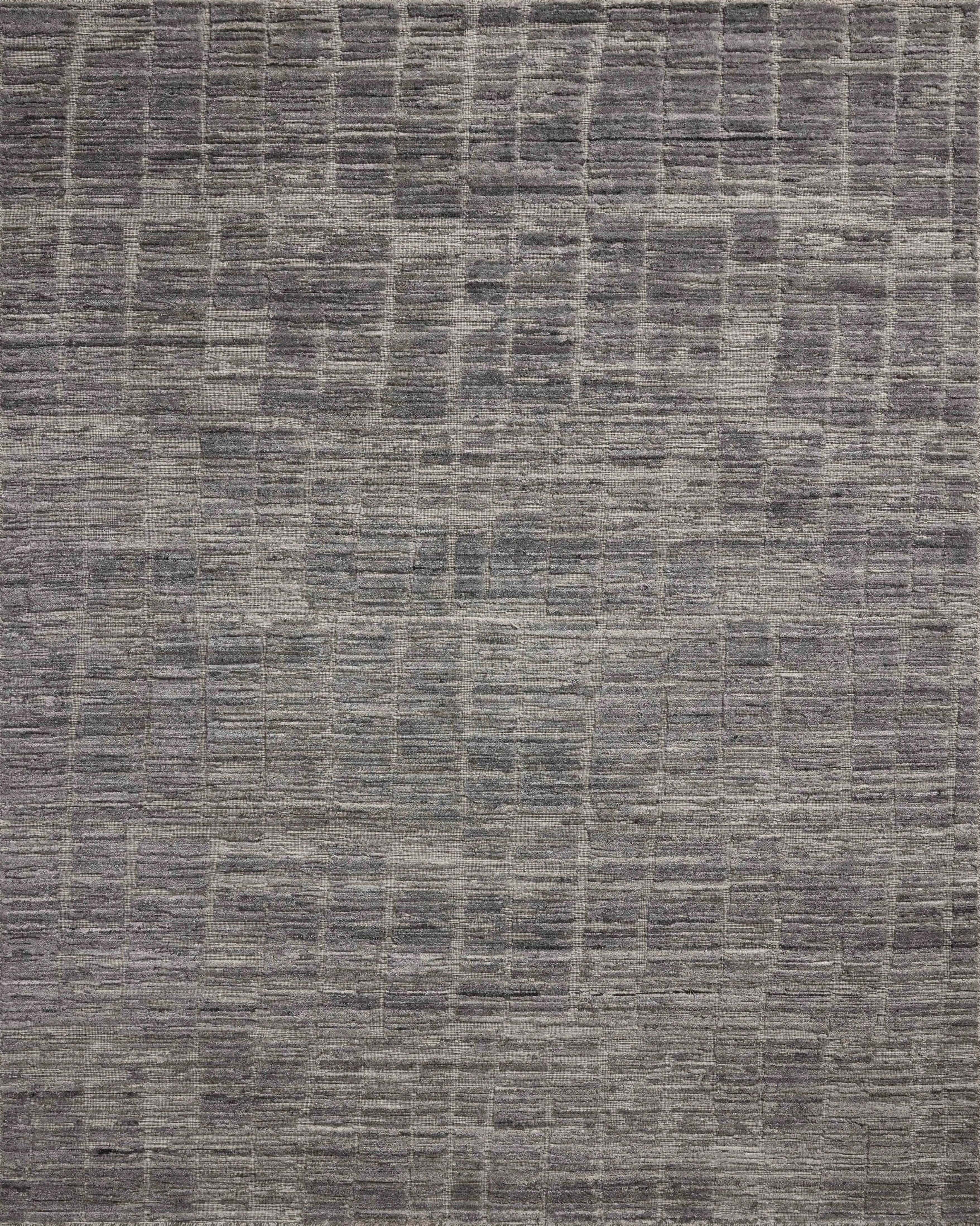 Area rugs in the Daniel Slate Rug have a graphic design in a range of tonal palettes with a soft, gently ribbed texture. The hand-loomed pile is a blend of bamboo and wool with a slight sheen that captures the light and changes the rug’s sense of depth throughout the day. Amethyst Home provides interior design, new home construction design consulting, vintage area rugs, and lighting in the Park City metro area.