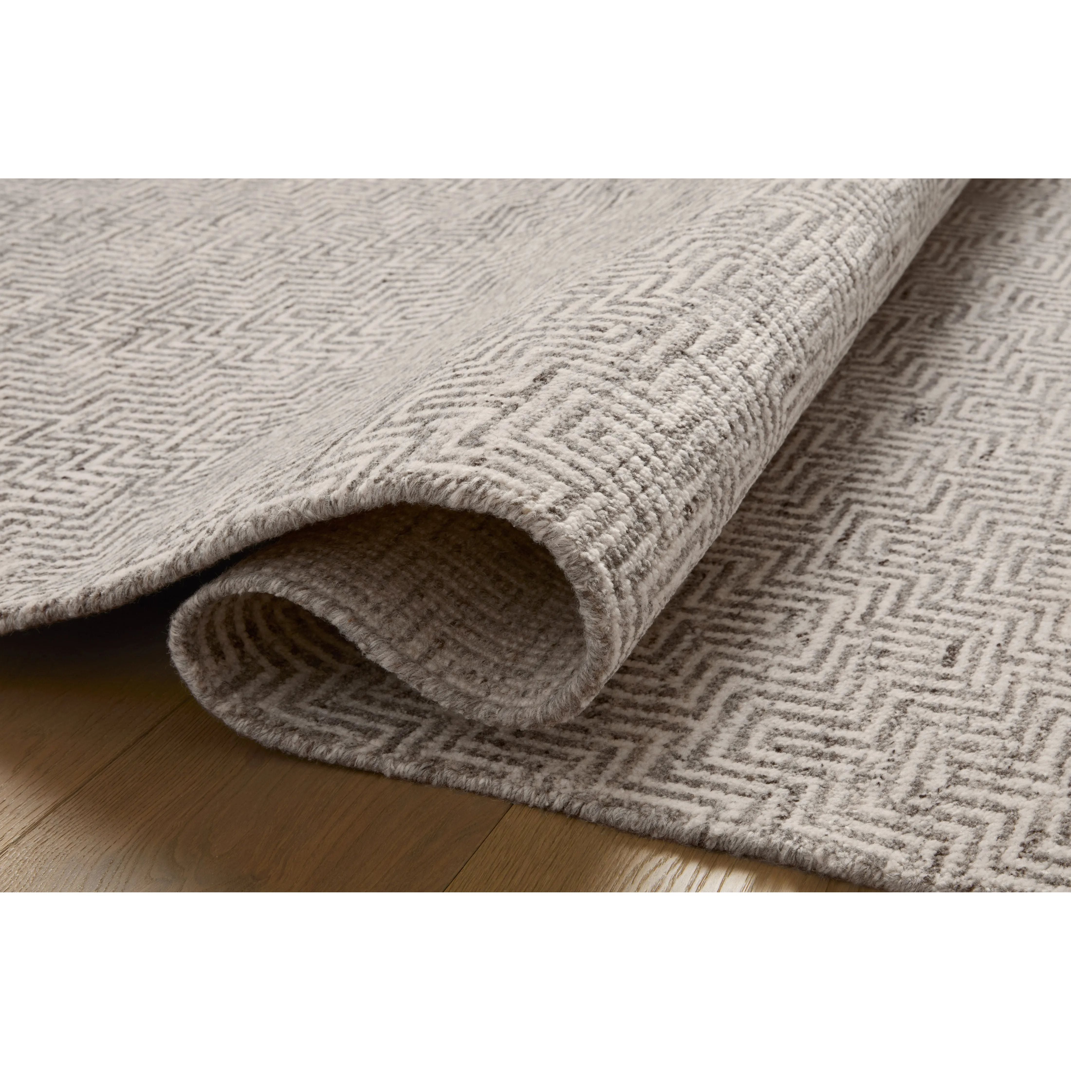 Featuring Jean Stoffer x Loloi Grace Dove Hand-Knotted Rug by Loloi at Amethyst Home. The Grace Dove Rug is a hand-knotted area rug with patterns inspired by traditional suiting fabrics, like houndstooth and tweed. The design’s smaller-scale patterns create depth, while the classic patterns invoke the warmth of English countryside interiors. This collection. Amethyst Home provides interior design, new home construction design consulting, vintage area rugs, and lighting in the Nashville metro area.