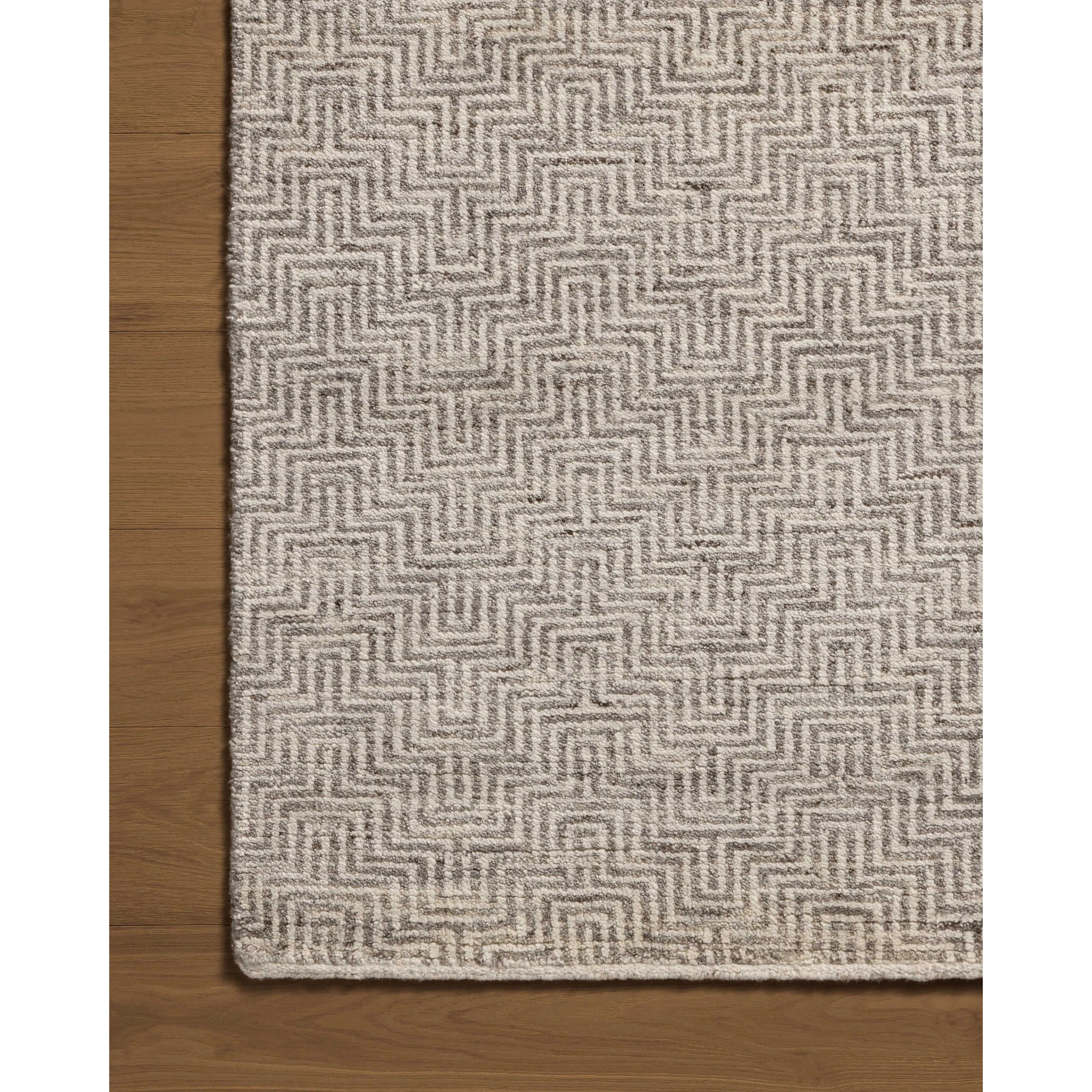 The Grace Dove Rug is a hand-knotted area rug with patterns inspired by traditional suiting fabrics, like houndstooth and tweed. The design’s smaller-scale patterns create depth, while the classic patterns invoke the warmth of English countryside interiors. Amethyst Home provides interior design, new home construction design consulting, vintage area rugs, and lighting in the Newport Beach metro area.