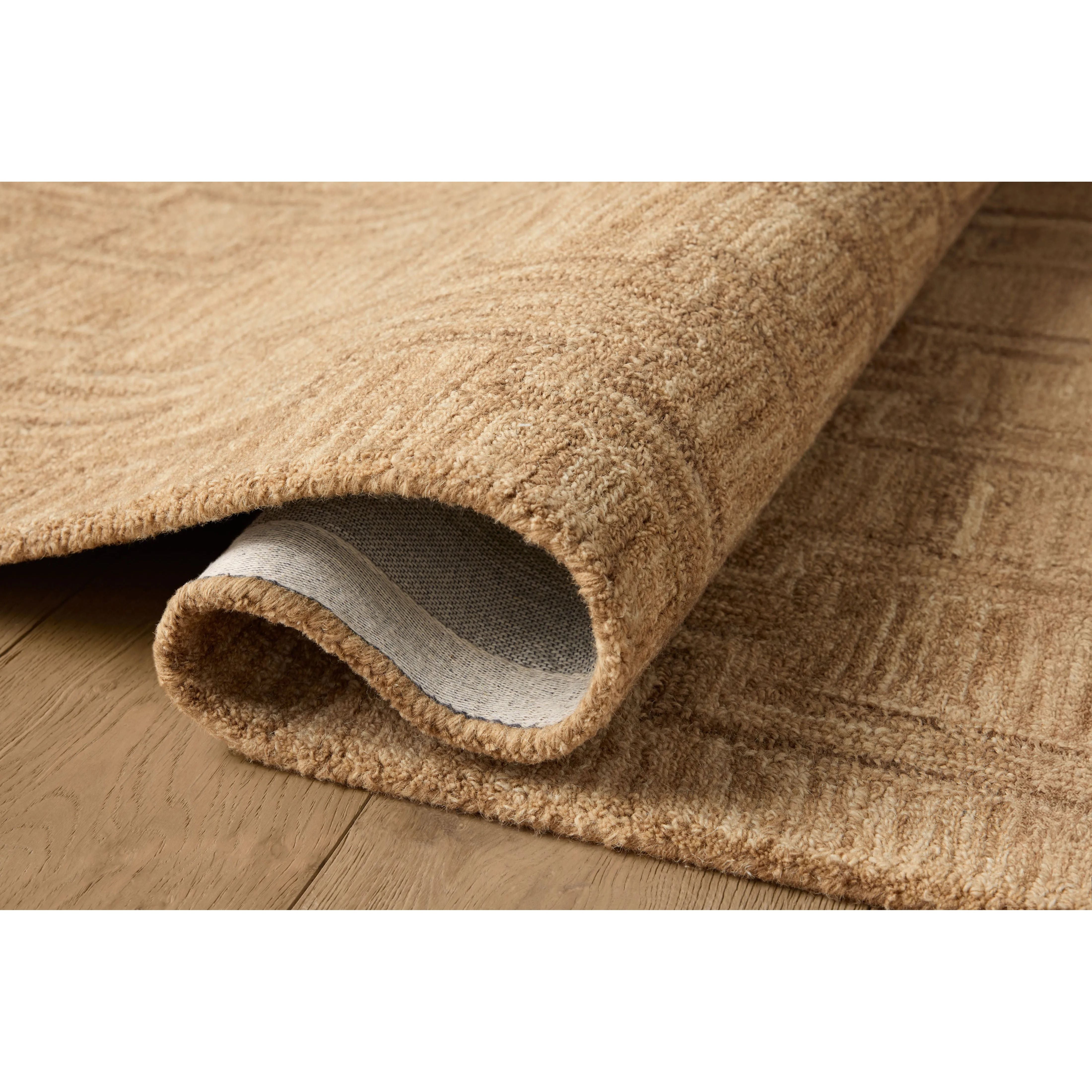 The Barrow Collection by Jeremiah Brent x Loloi is a hand-tufted area rug with a bold linear design inspired by modern art and classical architecture. The rug’s pile is a blend of wool and jute for a stable, substantial feel that can ground living rooms, dining rooms, bedrooms, and more. Amethyst Home provides interior design, new home construction design consulting, vintage area rugs, and lighting in the Dallas metro area.