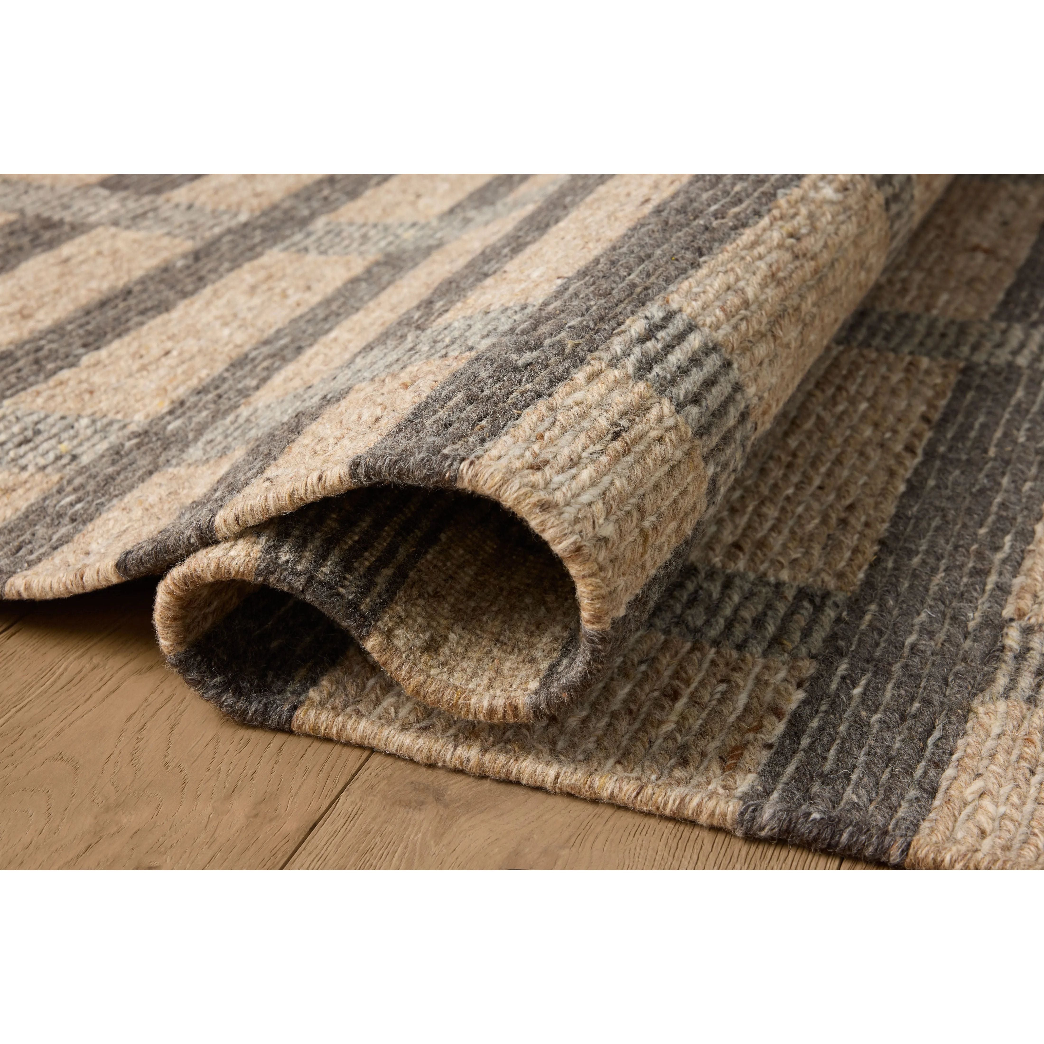 Featuring Jeremiah Brent x Loloi Perry Brown / Charcoal Rug by Loloi at Amethyst Home. The Perry Collection by Jeremiah Brent x Loloi is a singular area rug made with a special soumak weave construction, a labor-intensive process that creates beautiful details and a sturdy, thick weave. Perry combines a traditional craft with a modern linear pattern in rich . Amethyst Home provides interior design, new home construction design consulting, vintage area rugs, and lighting in the Monterey metro area.