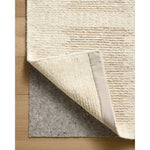 Featuring Jeremiah Brent x Loloi Perry Ivory / Taupe Rug by Loloi at Amethyst Home. The Perry Collection by Jeremiah Brent x Loloi is a singular area rug made with a special soumak weave construction, a labor-intensive process that creates beautiful details and a sturdy, thick weave. Perry combines a traditional craft with a modern linear pattern in rich yet mu. Amethyst Home provides interior design, new home construction design consulting, vintage area rugs, and lighting in the Miami metro area.