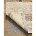 Featuring Jeremiah Brent x Loloi Perry Natural / Grey Rug by Loloi at Amethyst Home. The Perry Collection by Jeremiah Brent x Loloi is a singular area rug made with a special soumak weave construction, a labor-intensive process that creates beautiful details and a sturdy, thick weave. Perry combines a traditional craft with a modern linear pattern in rich yet . Amethyst Home provides interior design, new home construction design consulting, vintage area rugs, and lighting in the Austin metro area.