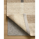 Featuring Jeremiah Brent x Loloi Perry Natural / Grey Rug by Loloi at Amethyst Home. The Perry Collection by Jeremiah Brent x Loloi is a singular area rug made with a special soumak weave construction, a labor-intensive process that creates beautiful details and a sturdy, thick weave. Perry combines a traditional craft with a modern linear pattern in rich yet . Amethyst Home provides interior design, new home construction design consulting, vintage area rugs, and lighting in the Austin metro area.