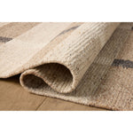 Featuring Jeremiah Brent x Loloi Perry Natural / Grey Rug by Loloi at Amethyst Home. The Perry Collection by Jeremiah Brent x Loloi is a singular area rug made with a special soumak weave construction, a labor-intensive process that creates beautiful details and a sturdy, thick weave. Perry combines a traditional craft with a modern linear pattern in rich y. Amethyst Home provides interior design, new home construction design consulting, vintage area rugs, and lighting in the Park City metro area.