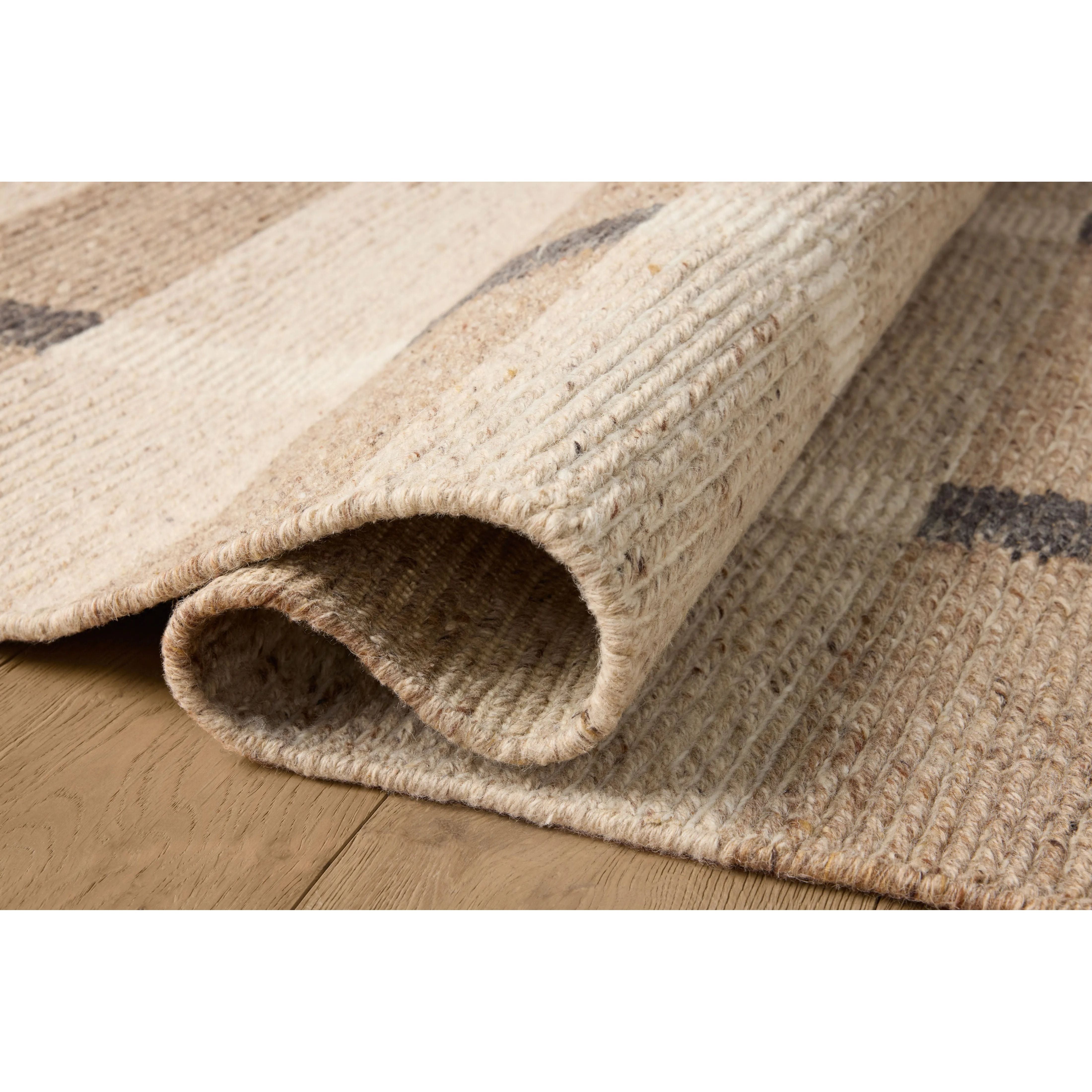 Featuring Jeremiah Brent x Loloi Perry Natural / Grey Rug by Loloi at Amethyst Home. The Perry Collection by Jeremiah Brent x Loloi is a singular area rug made with a special soumak weave construction, a labor-intensive process that creates beautiful details and a sturdy, thick weave. Perry combines a traditional craft with a modern linear pattern in rich y. Amethyst Home provides interior design, new home construction design consulting, vintage area rugs, and lighting in the Park City metro area.