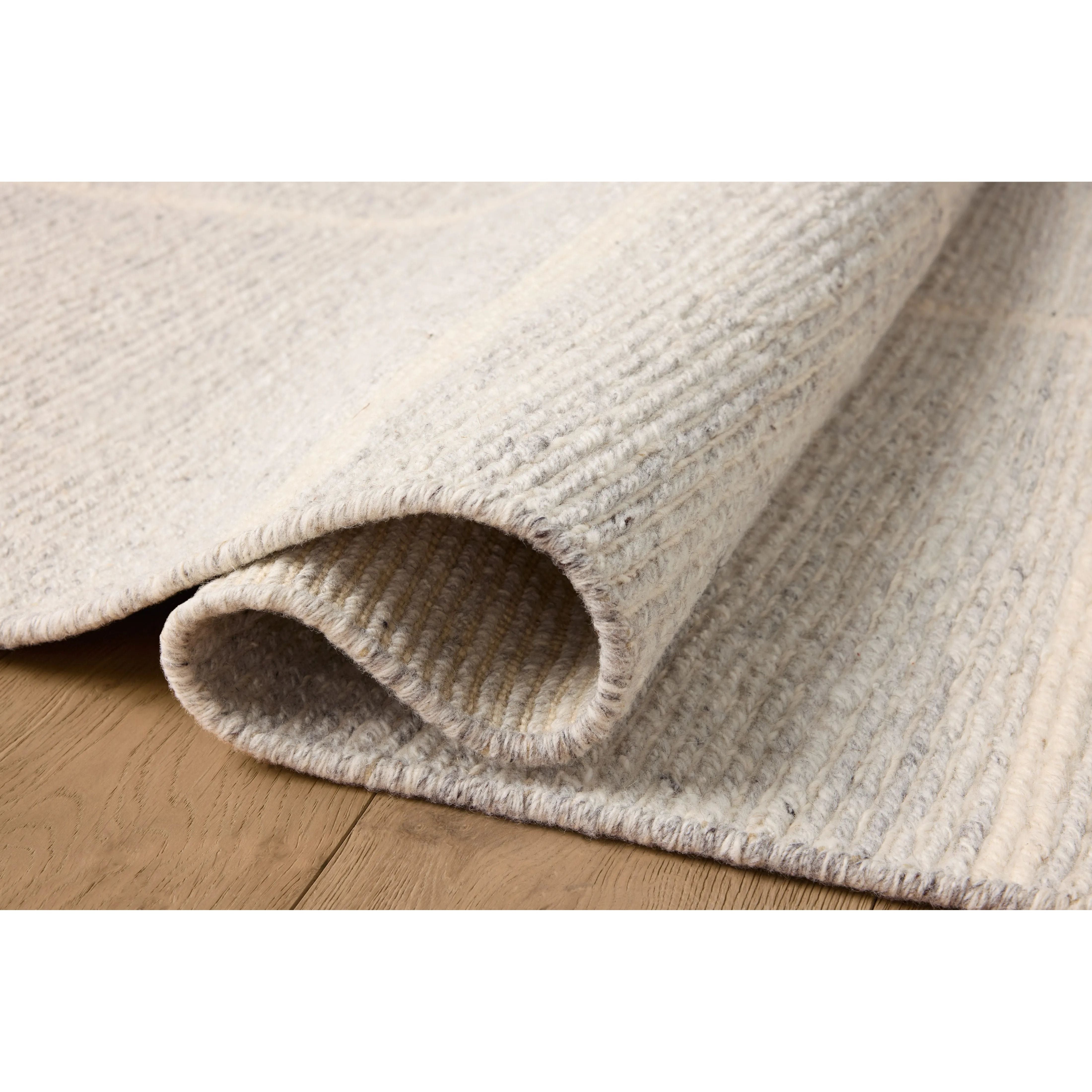 Featuring Jeremiah Brent x Loloi Perry Sky / Ivory Rug by Loloi at Amethyst Home. The Perry Collection by Jeremiah Brent x Loloi is a singular area rug made with a special soumak weave construction, a labor-intensive process that creates beautiful details and a sturdy, thick weave. Perry combines a traditional craft with a modern linear pattern in rich yet . Amethyst Home provides interior design, new home construction design consulting, vintage area rugs, and lighting in the Charlotte metro area.