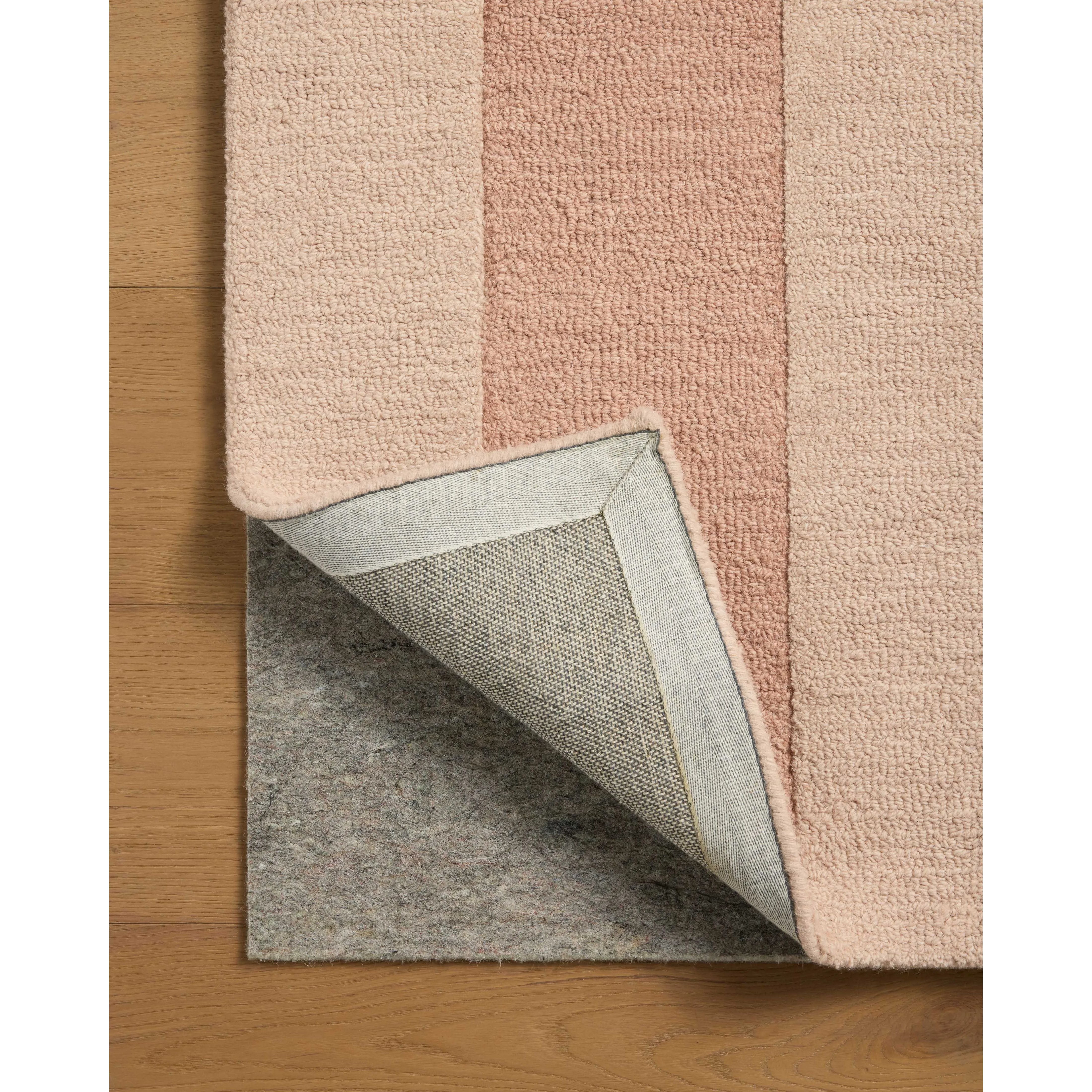 The Craven Collection is a hand-tufted area rug based on designs by Leanne Ford and made in collaboration with Loloi. Ford sketched classic stripes and checkerboards with an organic, free-flowing hand. The design comes to life with subtle space-dyed wool in creamy neutrals and rich, earthy tones. Amethyst Home provides interior design, new home construction design consulting, vintage area rugs, and lighting in the Winter Garden metro area.