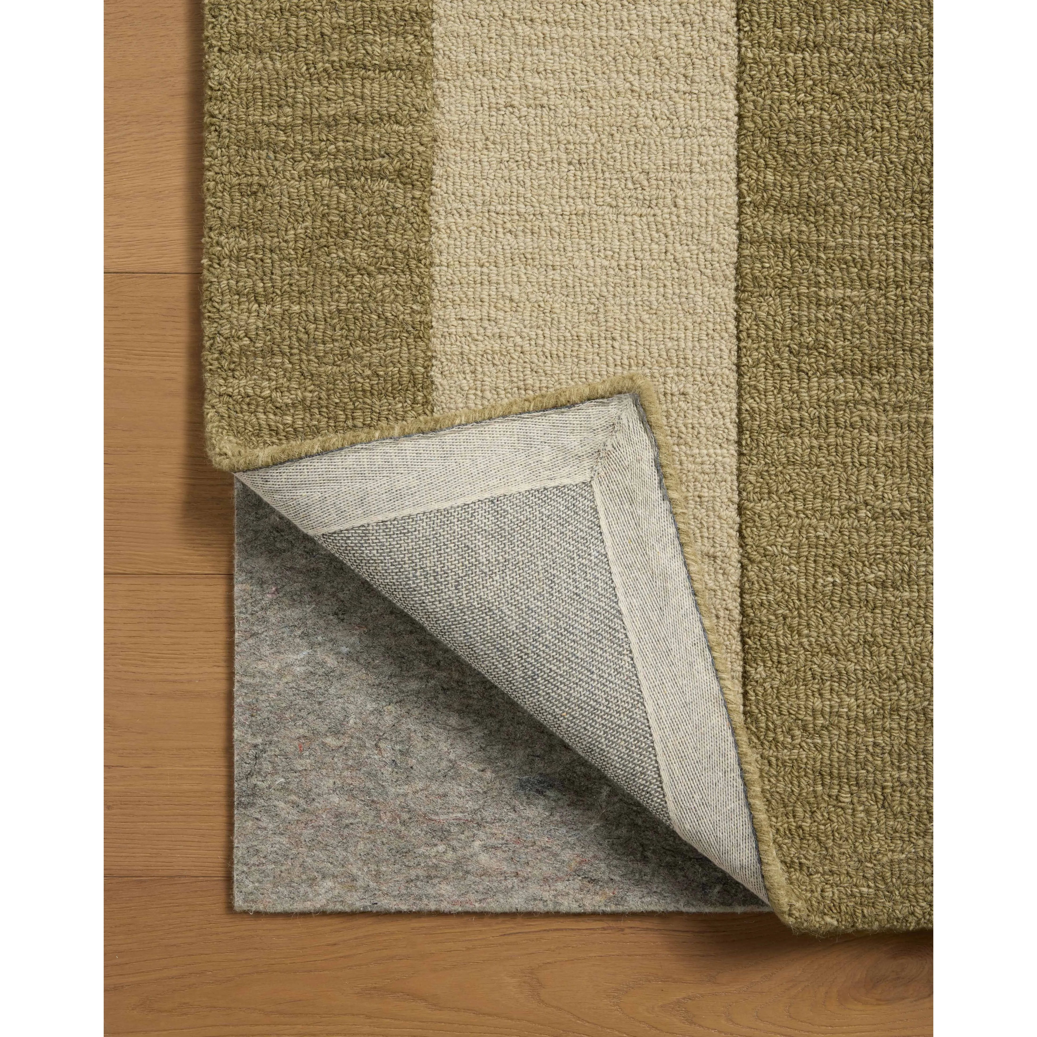 The Craven Collection is a hand-tufted area rug based on designs by Leanne Ford and made in collaboration with Loloi. Ford sketched classic stripes and checkerboards with an organic, free-flowing hand. The design comes to life with subtle space-dyed wool in creamy neutrals and rich, earthy tones. Amethyst Home provides interior design, new home construction design consulting, vintage area rugs, and lighting in the Monterey metro area.