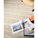 The Lennox Collection by Leanne Ford x Loloi is a statement area rug made with natural undyed wool that reveals subtle color differentiation in creamy neutral tones. The rug is hand-woven with a labor-intensive soumak weave, alternating rows of thick and thin looped yarns for an organic, inviting texture. Amethyst Home provides interior design, new home construction design consulting, vintage area rugs, and lighting in the Austin metro area.