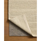 The Lennox Collection by Leanne Ford x Loloi is a statement area rug made with natural undyed wool that reveals subtle color differentiation in creamy neutral tones. The rug is hand-woven with a labor-intensive soumak weave, alternating rows of thick and thin looped yarns for an organic, inviting texture. Amethyst Home provides interior design, new home construction design consulting, vintage area rugs, and lighting in the Portland metro area.