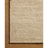 The Lennox Collection by Leanne Ford x Loloi is a statement area rug made with natural undyed wool that reveals subtle color differentiation in creamy neutral tones. The rug is hand-woven with a labor-intensive soumak weave, alternating rows of thick and thin looped yarns for an organic, inviting texture. Amethyst Home provides interior design, new home construction design consulting, vintage area rugs, and lighting in the Tampa metro area.