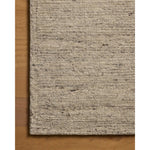 The Lennox Collection by Leanne Ford x Loloi is a statement area rug made with natural undyed wool that reveals subtle color differentiation in creamy neutral tones. The rug is hand-woven with a labor-intensive soumak weave, alternating rows of thick and thin looped yarns for an organic, inviting texture. Amethyst Home provides interior design, new home construction design consulting, vintage area rugs, and lighting in the Laguna Beach metro area.