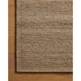 The Lennox Collection by Leanne Ford x Loloi is a statement area rug made with natural undyed wool that reveals subtle color differentiation in creamy neutral tones. The rug is hand-woven with a labor-intensive soumak weave, alternating rows of thick and thin looped yarns for an organic, inviting texture. Amethyst Home provides interior design, new home construction design consulting, vintage area rugs, and lighting in the Newport Beach metro area.