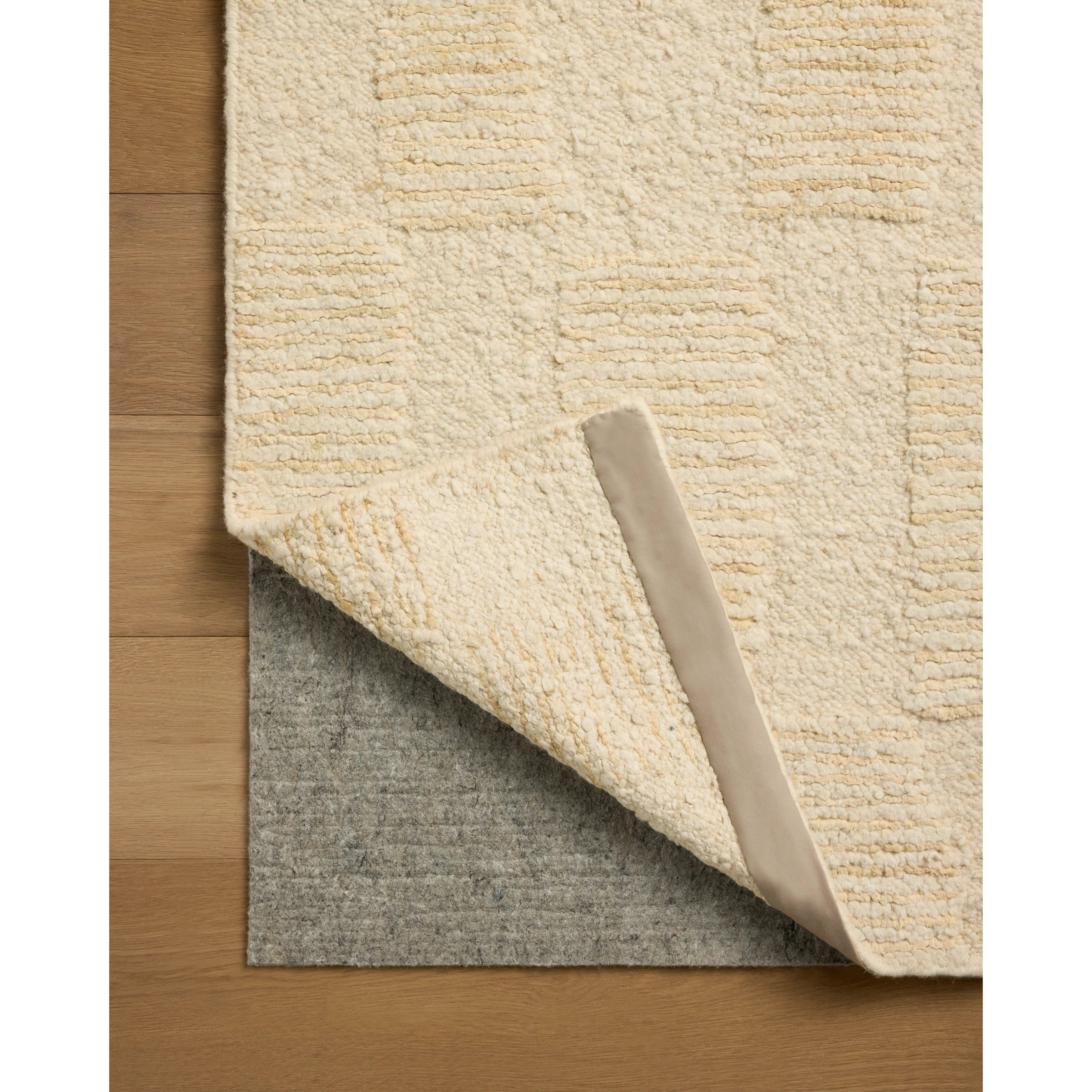 The Sowerby Collection is a wonderfully textural area rug by Leanne Ford x Loloi with a unique construction: alternating high-cut wool and jute pile on a nubby flatweave base to create an organic checkerboard pattern. Available in creamy neutrals and rich, earthy tones, Sowerby is a sophisticated neutral rug for living rooms, bedrooms, and more. Amethyst Home provides interior design, new home construction design consulting, vintage area rugs, and lighting in the Nashville metro area.