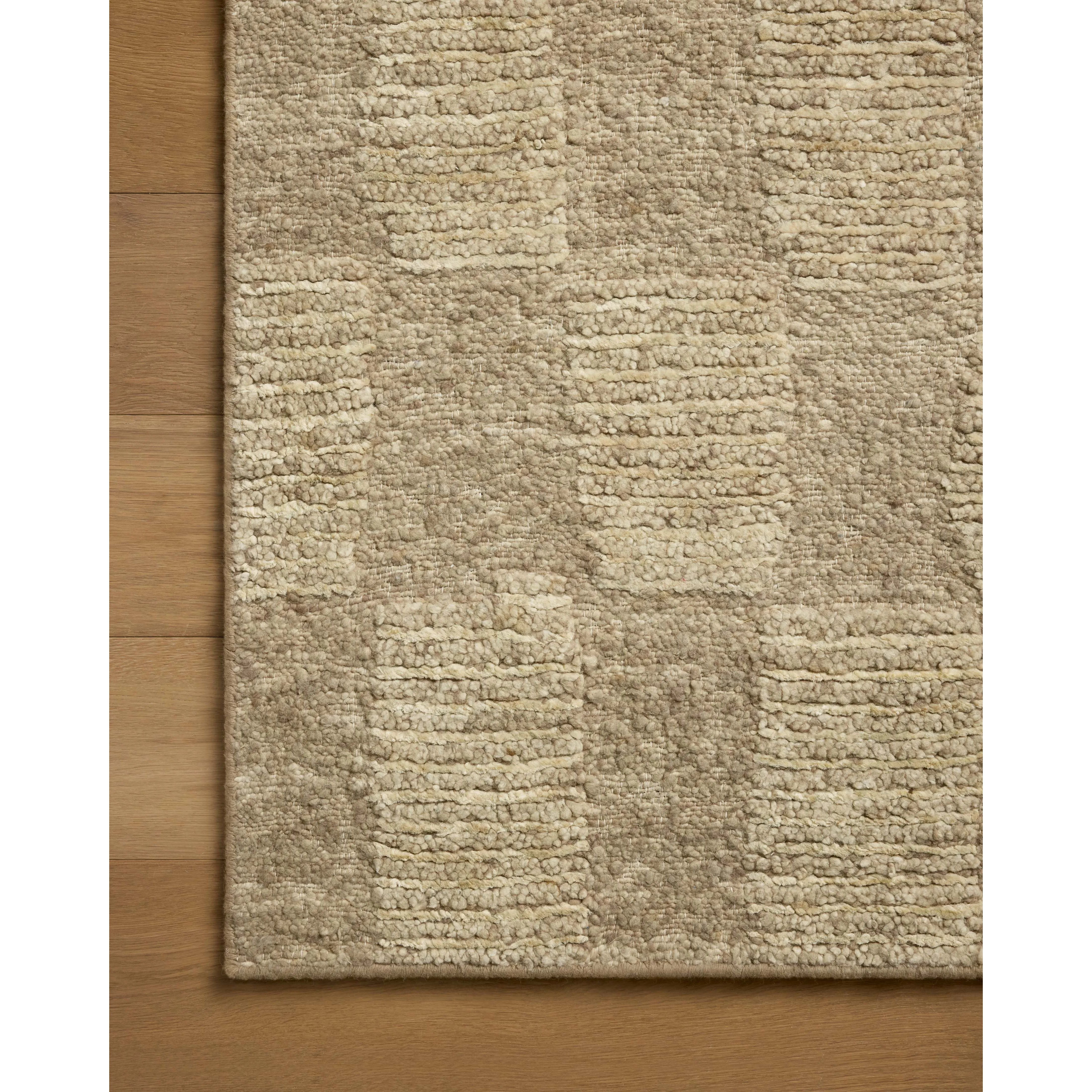 The Sowerby Collection is a wonderfully textural area rug by Leanne Ford x Loloi with a unique construction: alternating high-cut wool and jute pile on a nubby flatweave base to create an organic checkerboard pattern. Available in creamy neutrals and rich, earthy tones, Sowerby is a sophisticated neutral rug for living rooms, bedrooms, and more. Amethyst Home provides interior design, new home construction design consulting, vintage area rugs, and lighting in the Tampa metro area.