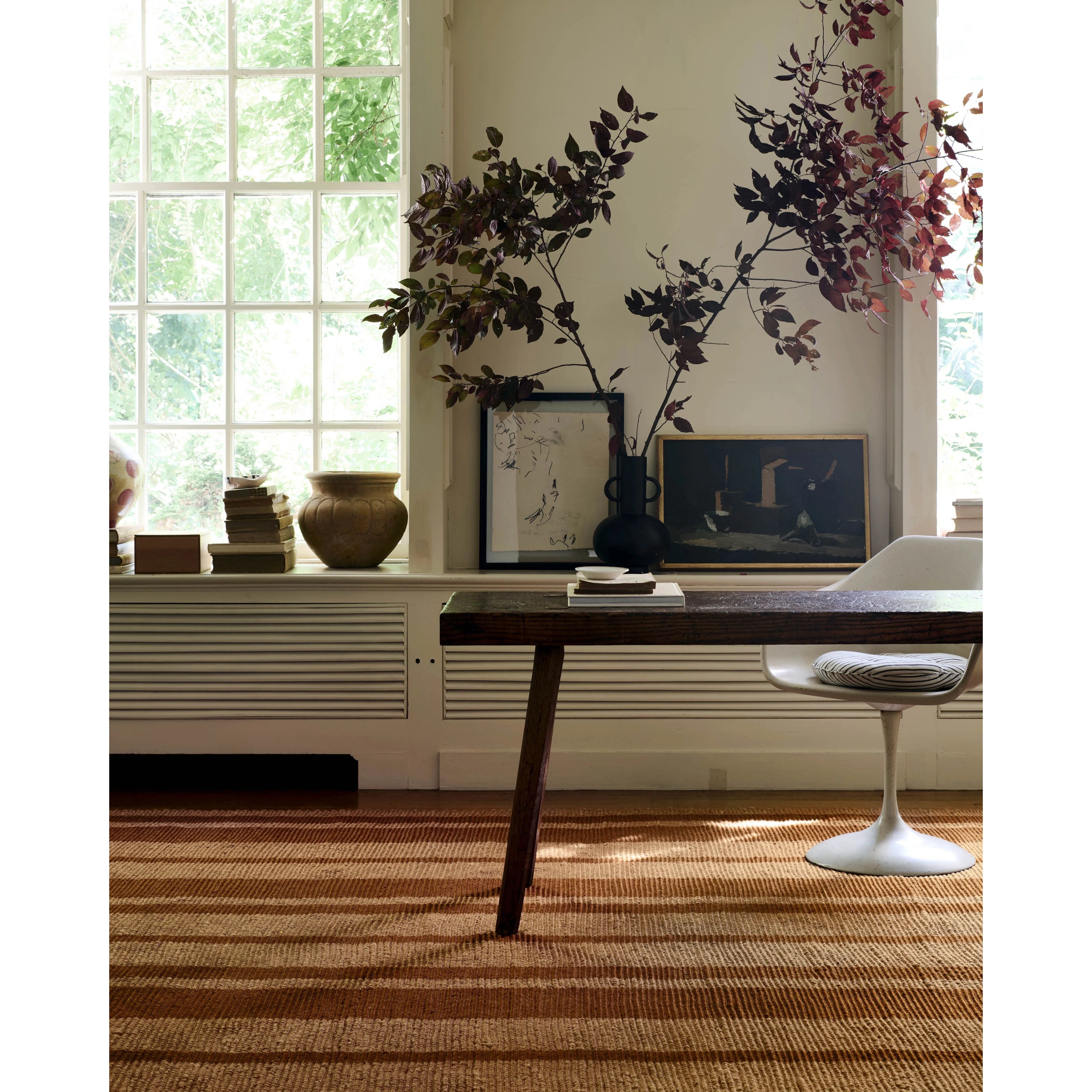 The Weatherstaff Collection is a vertically striped jute area rug with an organic look and feel, designed by Leanne Ford x Loloi. The earth-toned area rug features flatwoven jute that creates a ribbed texture horizontally, with stripes that are vertical—a playful combination. Amethyst Home provides interior design, new home construction design consulting, vintage area rugs, and lighting in the Kansas City metro area.