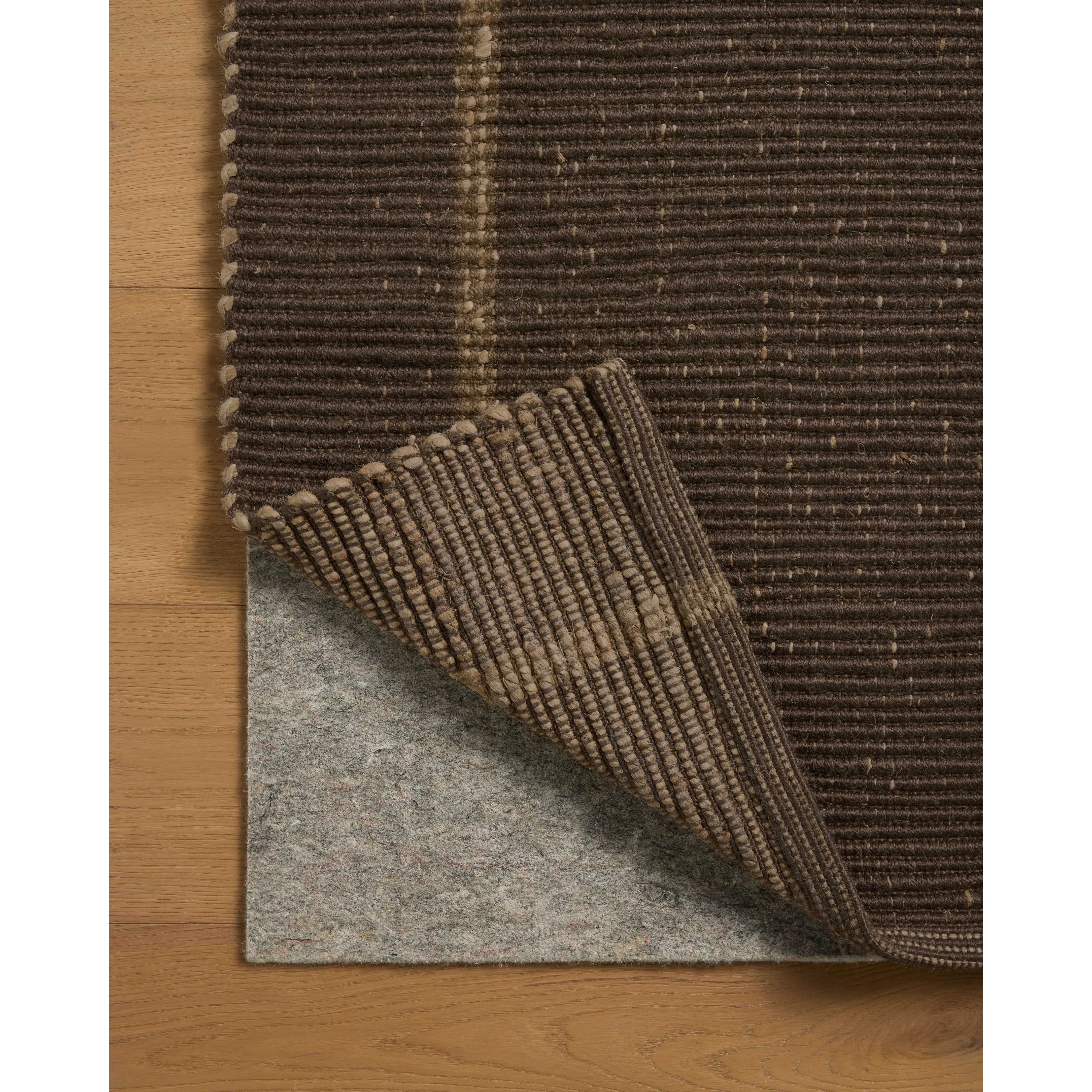 The Weatherstaff Collection is a vertically striped jute area rug with an organic look and feel, designed by Leanne Ford x Loloi. The earth-toned area rug features flatwoven jute that creates a ribbed texture horizontally, with stripes that are vertical—a playful combination. Amethyst Home provides interior design, new home construction design consulting, vintage area rugs, and lighting in the Tampa metro area.