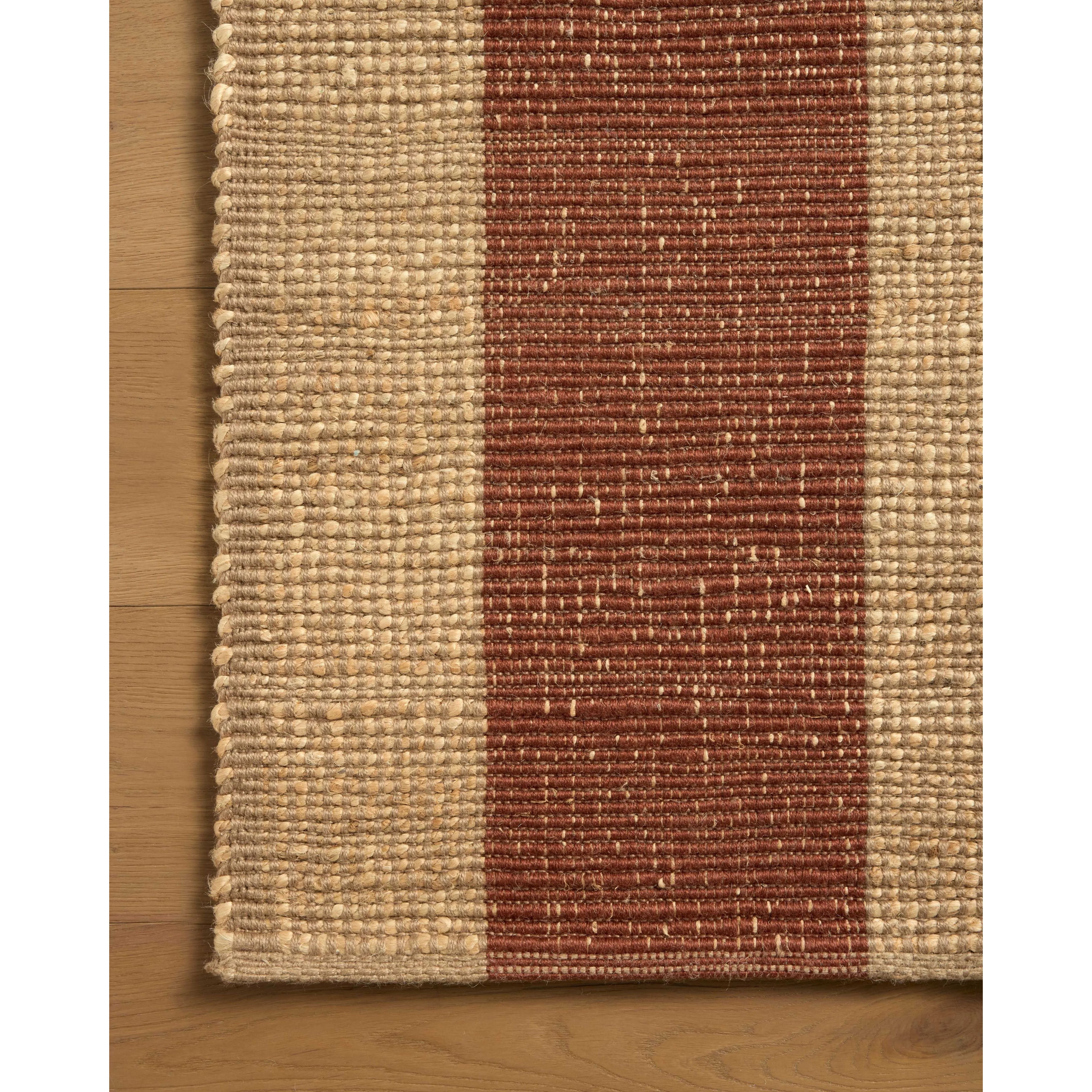 The Weatherstaff Collection is a vertically striped jute area rug with an organic look and feel, designed by Leanne Ford x Loloi. The earth-toned area rug features flatwoven jute that creates a ribbed texture horizontally, with stripes that are vertical—a playful combination. Amethyst Home provides interior design, new home construction design consulting, vintage area rugs, and lighting in the San Diego metro area.