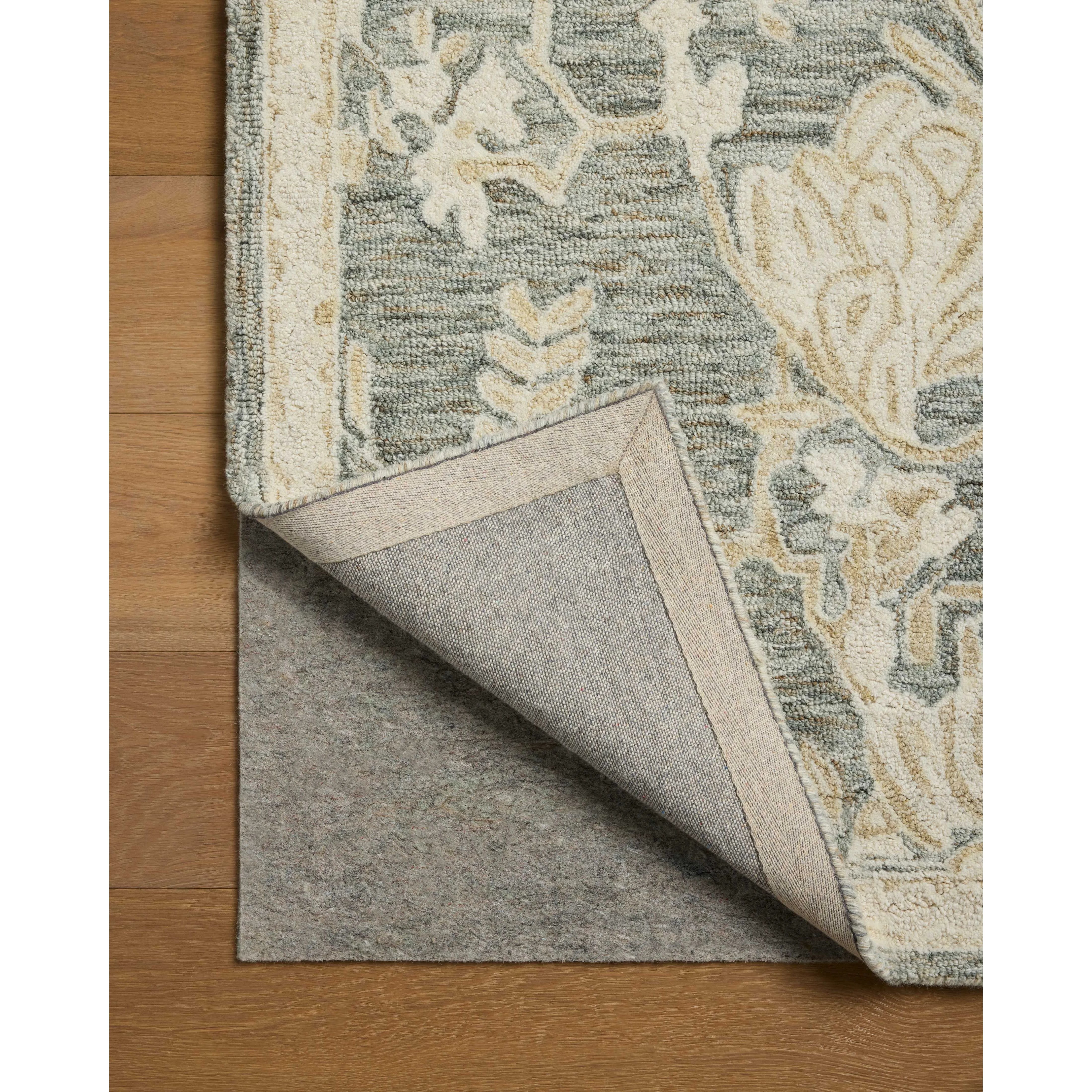 The Lenore Collection is a floral wool area rug with a two-toned design for elegant home decor. The rug's intricate linework is cut pile and the base is looped yarn, which gives the florals a slightly raised appearance and lovely depth. Amethyst Home provides interior design, new home construction design consulting, vintage area rugs, and lighting in the Omaha metro area.