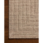 The Maren Collection is a unique handmade area rug made with a new technique that creates a dotted texture, almost like fine embroidery, but with a substantial hand-loomed feel. The pile reveals modern geometric patterns with organic shapes and natural softness, available in light, easygoing neutrals. Amethyst Home provides interior design, new home construction design consulting, vintage area rugs, and lighting in the Tampa metro area.