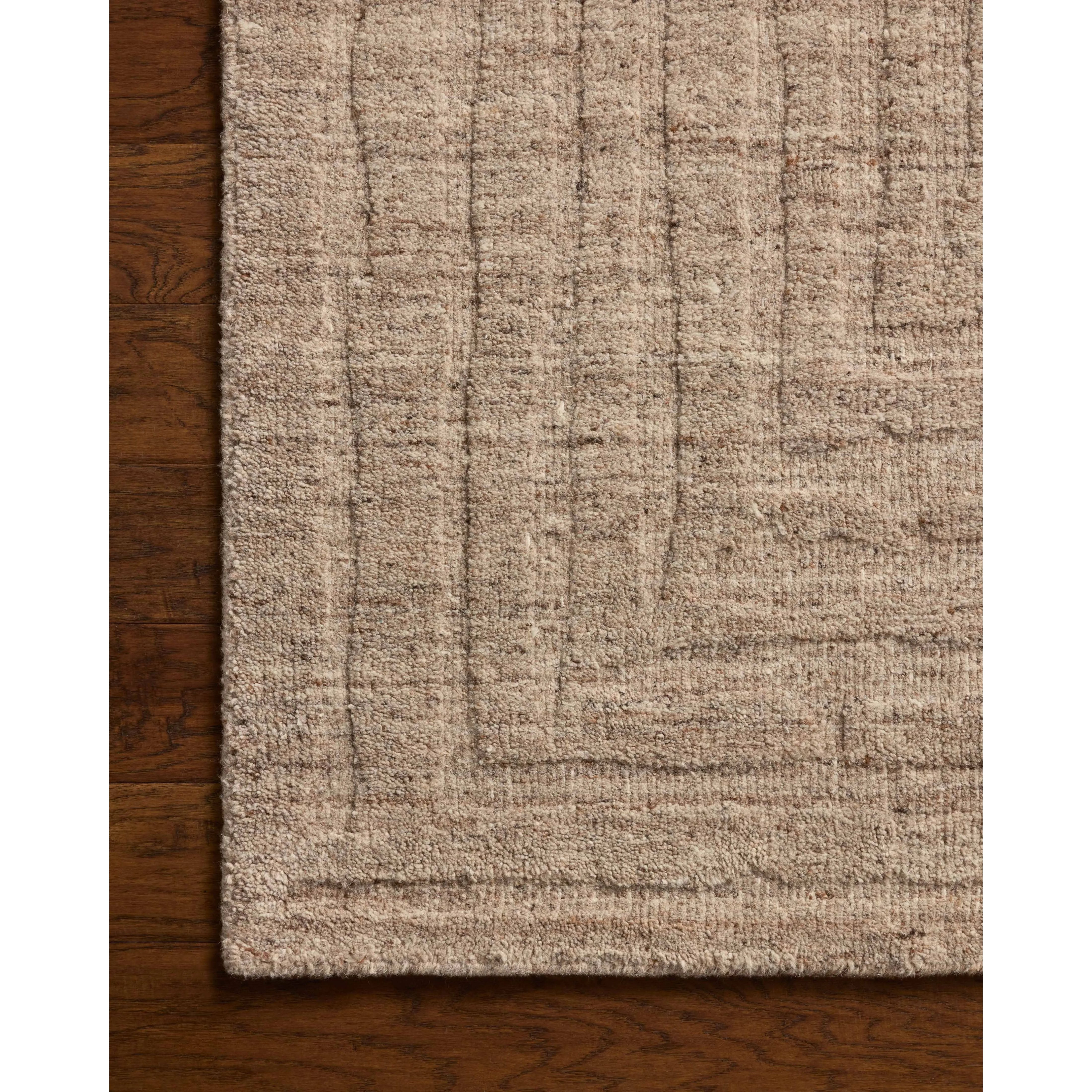 The Maren Collection is a unique handmade area rug made with a new technique that creates a dotted texture, almost like fine embroidery, but with a substantial hand-loomed feel. The pile reveals modern geometric patterns with organic shapes and natural softness, available in light, easygoing neutrals. Amethyst Home provides interior design, new home construction design consulting, vintage area rugs, and lighting in the Tampa metro area.