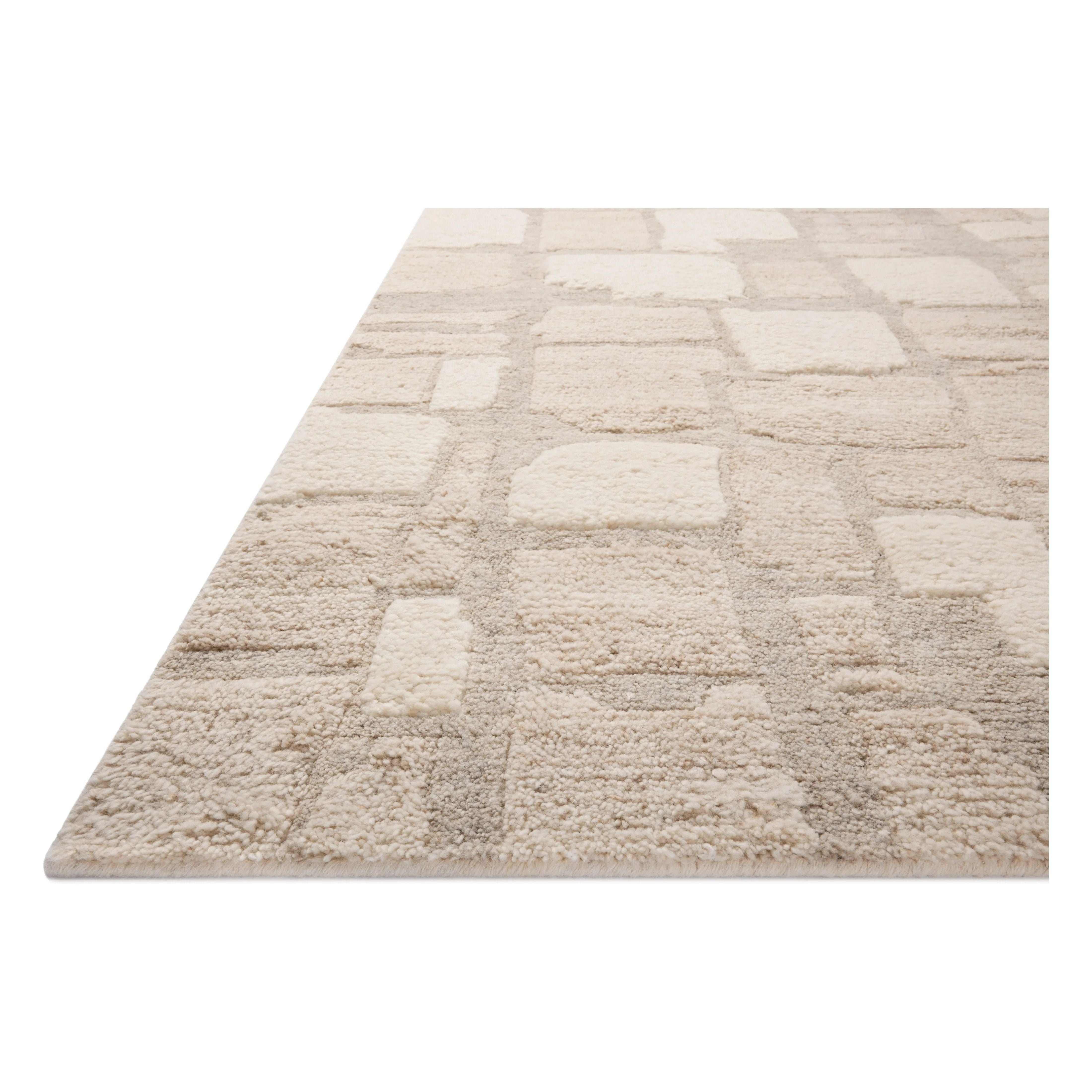 Featuring Octavia Stone / Sand Rug by Loloi at Amethyst Home. Inspired by classic Moroccan rug motifs and nature's asymmetry, area rugs in the Octavia Collection make a timeless statement. This hand-knotted design plays with pile height and shapes while adding the warmth of wool in a fresh, natural palette. Made in India and GoodWeave-certified, ensuring ou. Amethyst Home provides interior design, new home construction design consulting, vintage area rugs, and lighting in the Nashville metro area.