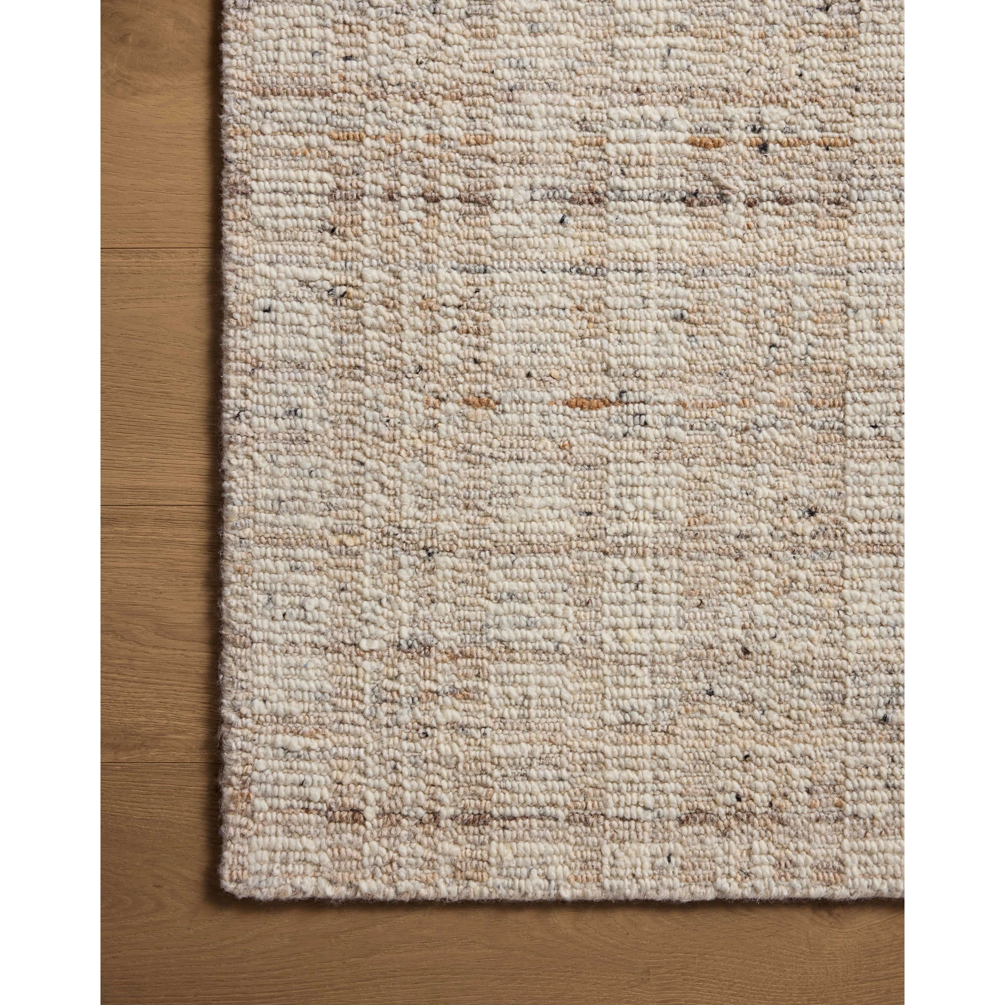 The Sonya Ivory / Natural Rug is a hand-loomed area rug with a light, airy palette and understated graphic design. The rug’s textural pile is a soft blend of wool and nylon that creates dimension in living rooms, bedrooms, and more. Amethyst Home provides interior design, new home construction design consulting, vintage area rugs, and lighting in the Monterey metro area.