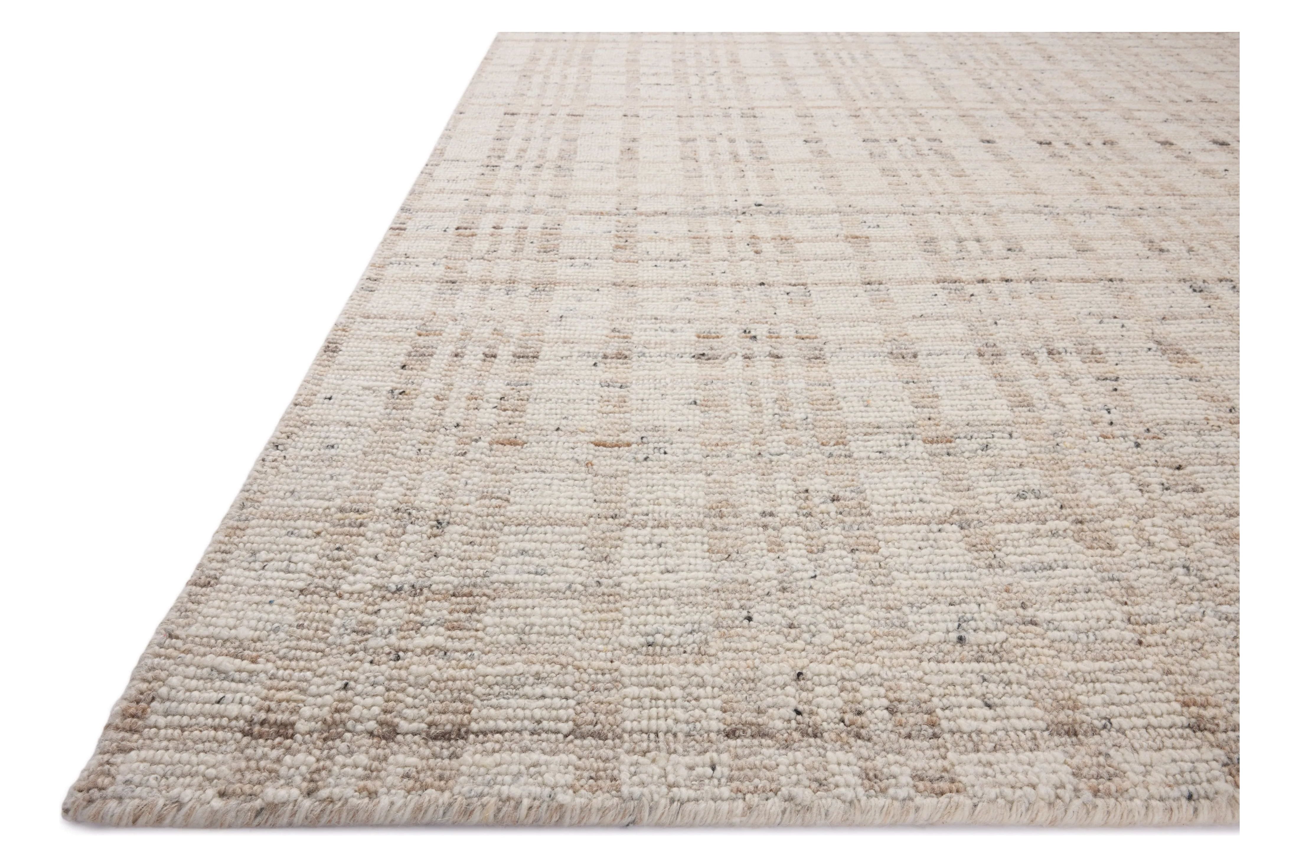 The Sonya Ivory / Natural Rug is a hand-loomed area rug with a light, airy palette and understated graphic design. The rug’s textural pile is a soft blend of wool and nylon that creates dimension in living rooms, bedrooms, and more. Amethyst Home provides interior design, new home construction design consulting, vintage area rugs, and lighting in the San Diego metro area.