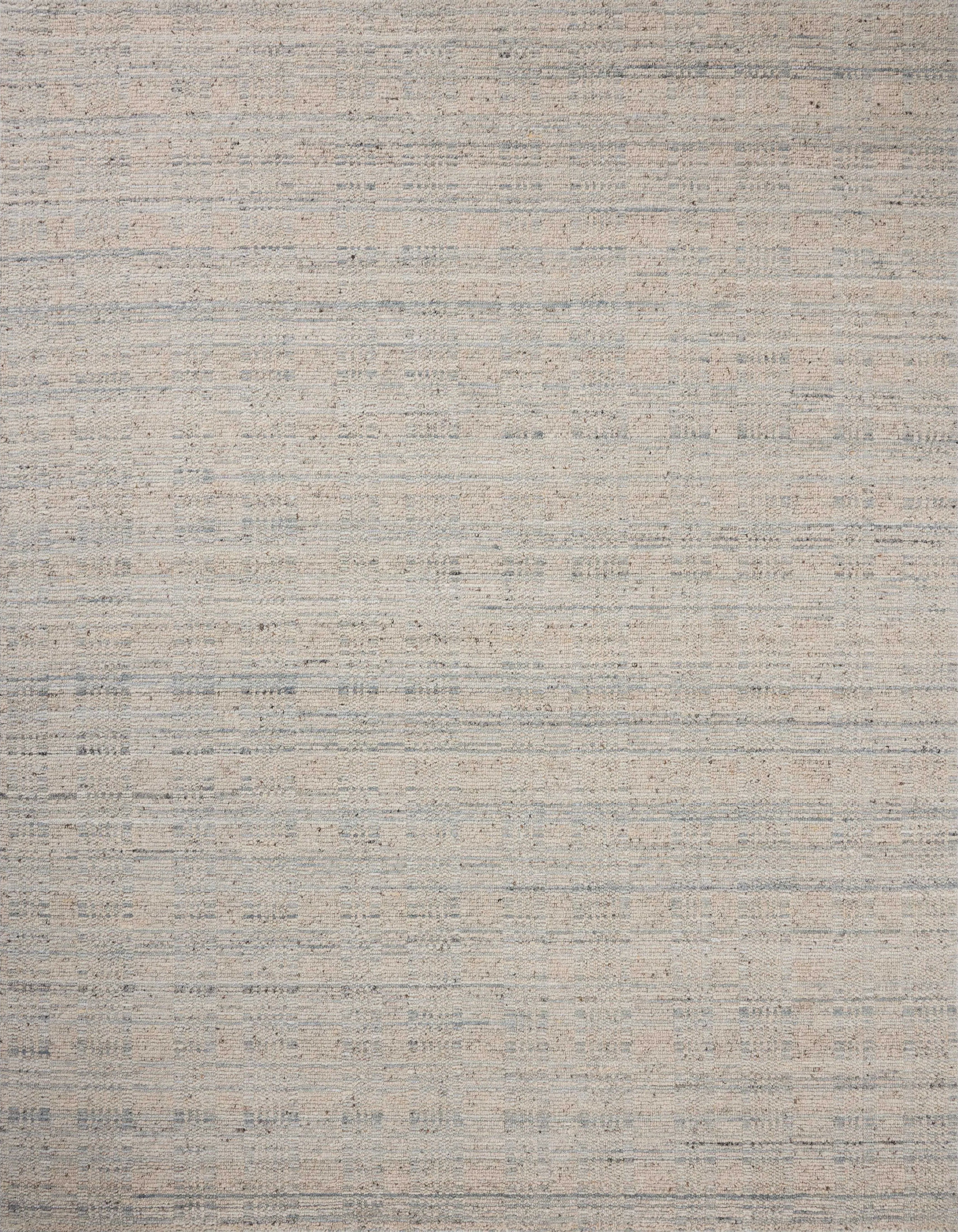 The Sonya Mist / Oatmeal Rug is a hand-loomed area rug with a light, airy palette and understated graphic design. The rug’s textural pile is a soft blend of wool and nylon that creates dimension in living rooms, bedrooms, and more. Amethyst Home provides interior design, new home construction design consulting, vintage area rugs, and lighting in the Monterey metro area.