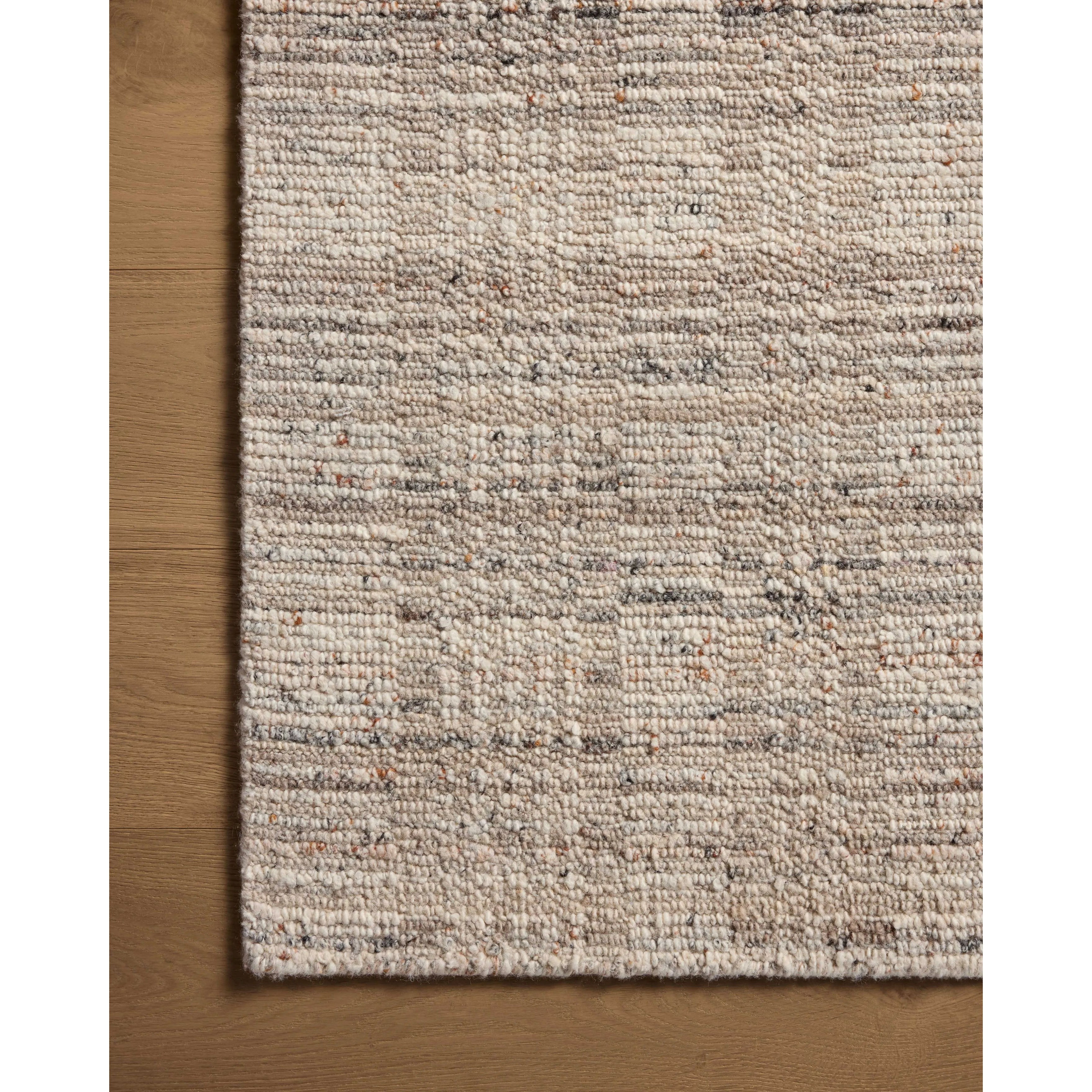 The Sonya Pebble / Fog Rug is a hand-loomed area rug with a light, airy palette and understated graphic design. The rug’s textural pile is a soft blend of wool and nylon that creates dimension in living rooms, bedrooms, and more. Amethyst Home provides interior design, new home construction design consulting, vintage area rugs, and lighting in the Newport Beach metro area.