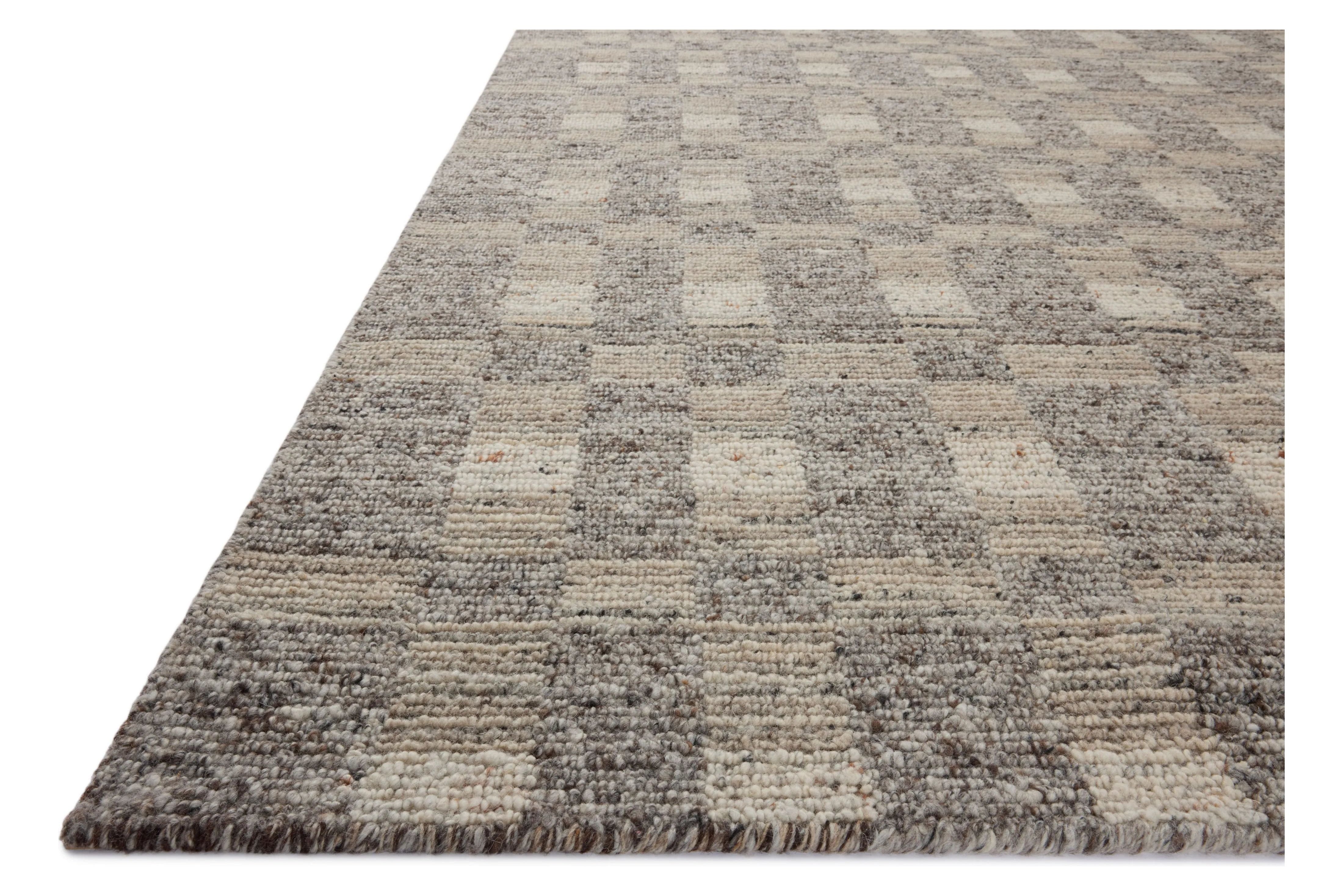 The Sonya Stone / Natural Rug is a hand-loomed area rug with a light, airy palette and understated graphic design. The rug’s textural pile is a soft blend of wool and nylon that creates dimension in living rooms, bedrooms, and more. Amethyst Home provides interior design, new home construction design consulting, vintage area rugs, and lighting in the Des Moines metro area.