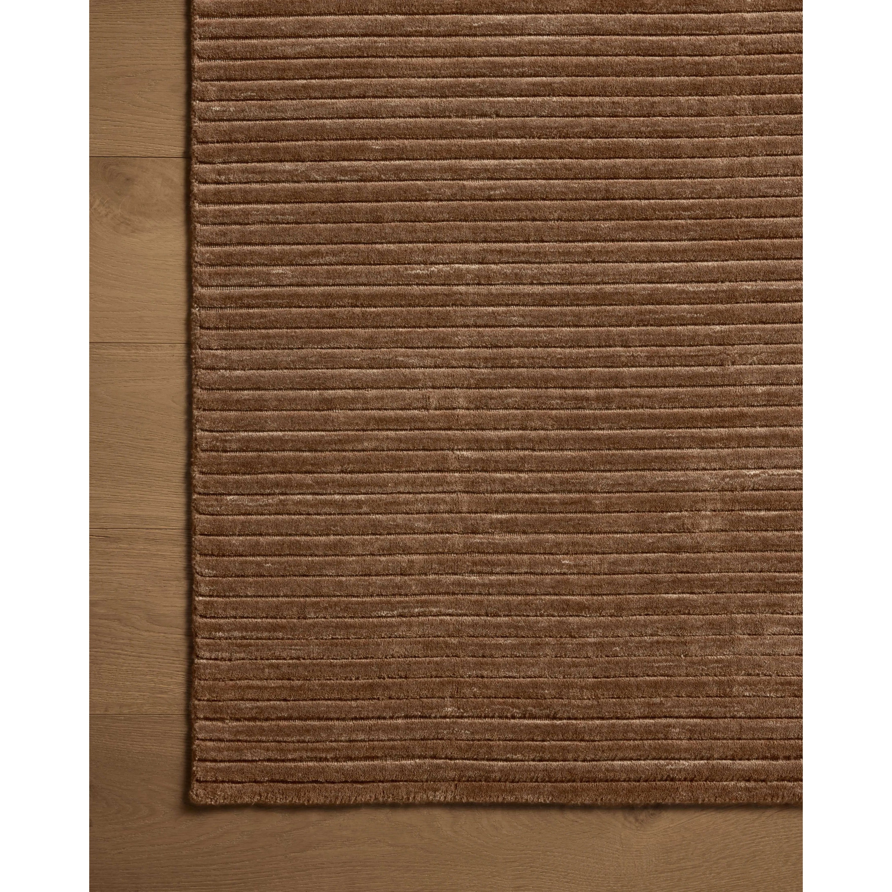 Sophisticated ribbing runs across the Sterling Mocha Rug, a nicely textured area rug with a natural color palette rich in tonality. Sterling is hand-loomed of polyester that’s refreshingly easy to clean and withstands high-traffic in living rooms, dining rooms, or bedrooms. Amethyst Home provides interior design, new home construction design consulting, vintage area rugs, and lighting in the Monterey metro area.