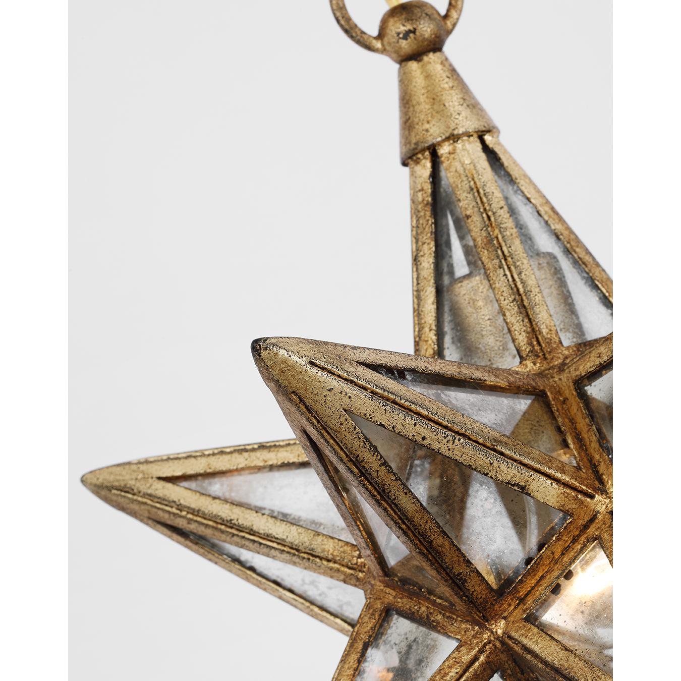 Featuring Moravian Small Star Lantern Gilded Iron by Visual Comfort at Amethyst Home. The Chapman & Myers Moravian Star reinterprets the classic multi-pointed star in antiqued mirror glass and metal, available in multiple finishes. Styled as a single lantern or combined to create a starry statement piece, the geometric lighting will lend a jewelry-like accent to modern interiors.
. Amethyst Home provides interior design, new construction, custom furniture, and area rugs in the Nashville metro area