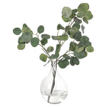 Transform your space with the green Eucalyptus, beautifully arranged in a glass vase. Standing at 20", this lifelike faux design adds sophistication, perfect for a dining table centerpiece or console display. Admire the lifelike blooms and rich foliage, providing a timeless touch to your home's ambiance Amethyst Home provides interior design, new home construction design consulting, vintage area rugs, and lighting in the Seattle metro area.