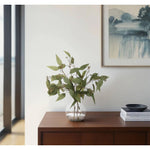 Bring timeless beauty into your home with the green Eucalyptus in a glass bubble. Standing at 18", this lifelike faux design adds sophistication, perfect for a dining table centerpiece or console display. Admire the lifelike blooms and rich foliage, providing a timeless touch to your home's ambiance Amethyst Home provides interior design, new home construction design consulting, vintage area rugs, and lighting in the Seattle metro area.