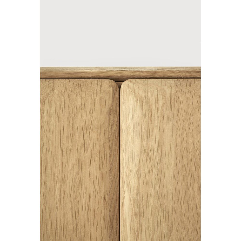 Featuring Pi Oak Sideboard by Ethnicraft at Amethyst Home. The PI collection honours nature’s design by keeping the strength, curves and lines, as nature intended. Interesting shapes are discovered in this sleek and stylish, polished imperfect, finish. Each PI item is finished by hand to ensure that the individual character of the wood is respected. The PI sideboard is striking and u. Amethyst Home provides interior design, new construction, custom furniture, and area rugs in the Austin metro area