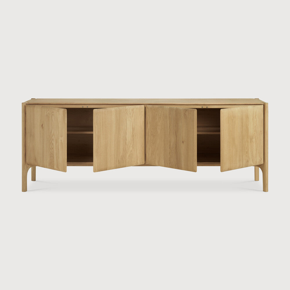Featuring Pi Oak Sideboard by Ethnicraft at Amethyst Home. The PI collection honours nature’s design by keeping the strength, curves and lines, as nature intended. Interesting shapes are discovered in this sleek and stylish, polished imperfect, finish. Each PI item is finished by hand to ensure that the individual character of the wood is respected. The PI sideboard is striking and u. Amethyst Home provides interior design, new construction, custom furniture, and area rugs in the Dallas metro area