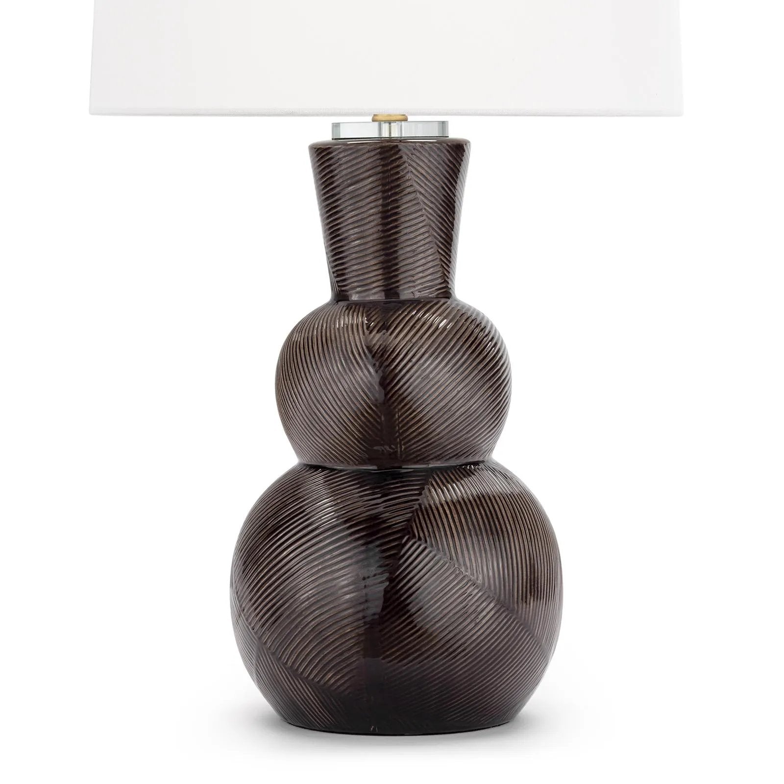 With its alluring silhouette, the Hugo ceramic table lamp brings contemporary appeal and modern contrast to interiors. Employing a specialized glazing technique, master artisans hand-shape earthenware to produce a luxurious finish for subtle highs and lows that shift with the light source above. Amethyst Home provides interior design, new home construction design consulting, vintage area rugs, and lighting in the Omaha metro area.
