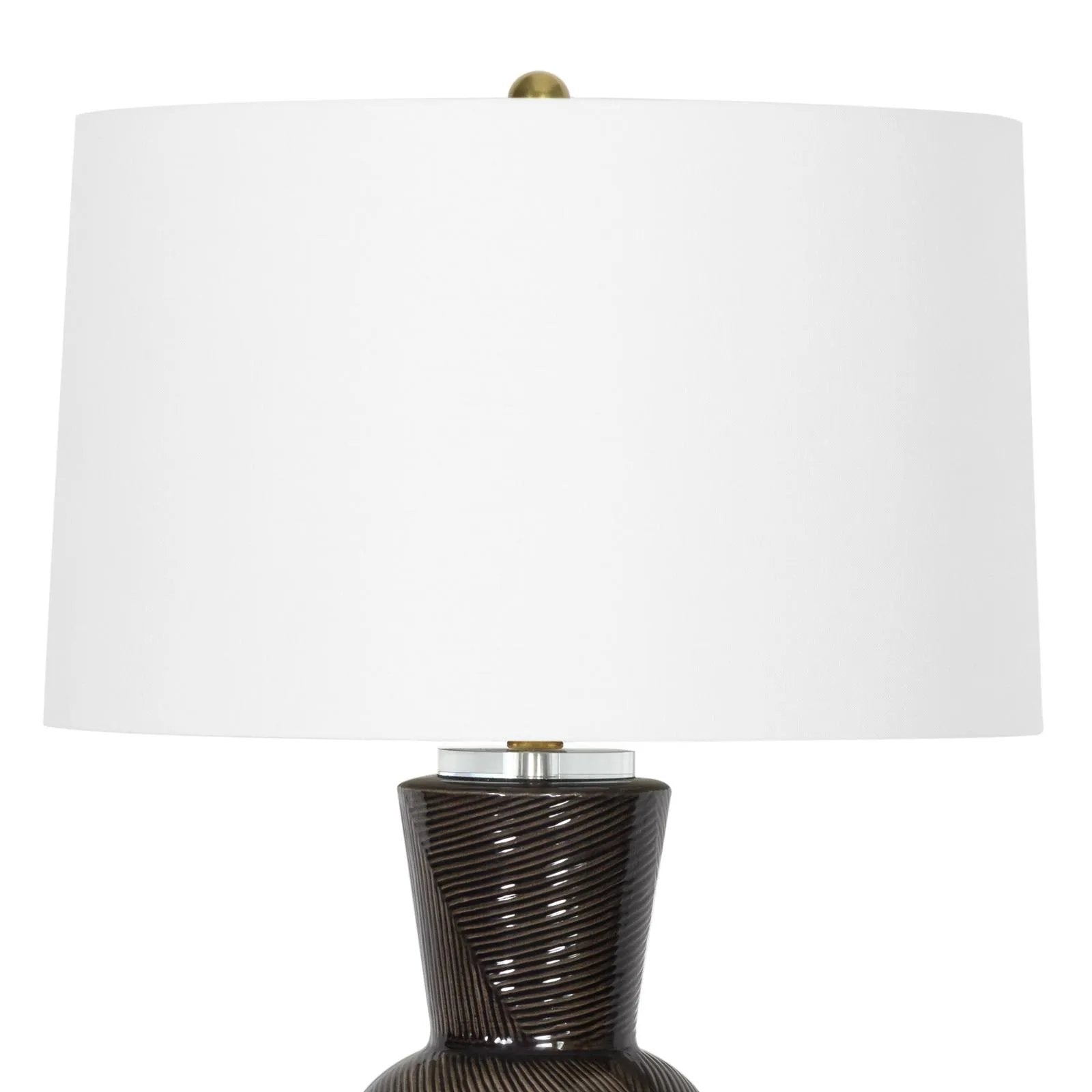 With its alluring silhouette, the Hugo ceramic table lamp brings contemporary appeal and modern contrast to interiors. Employing a specialized glazing technique, master artisans hand-shape earthenware to produce a luxurious finish for subtle highs and lows that shift with the light source above. Amethyst Home provides interior design, new home construction design consulting, vintage area rugs, and lighting in the Tampa metro area.