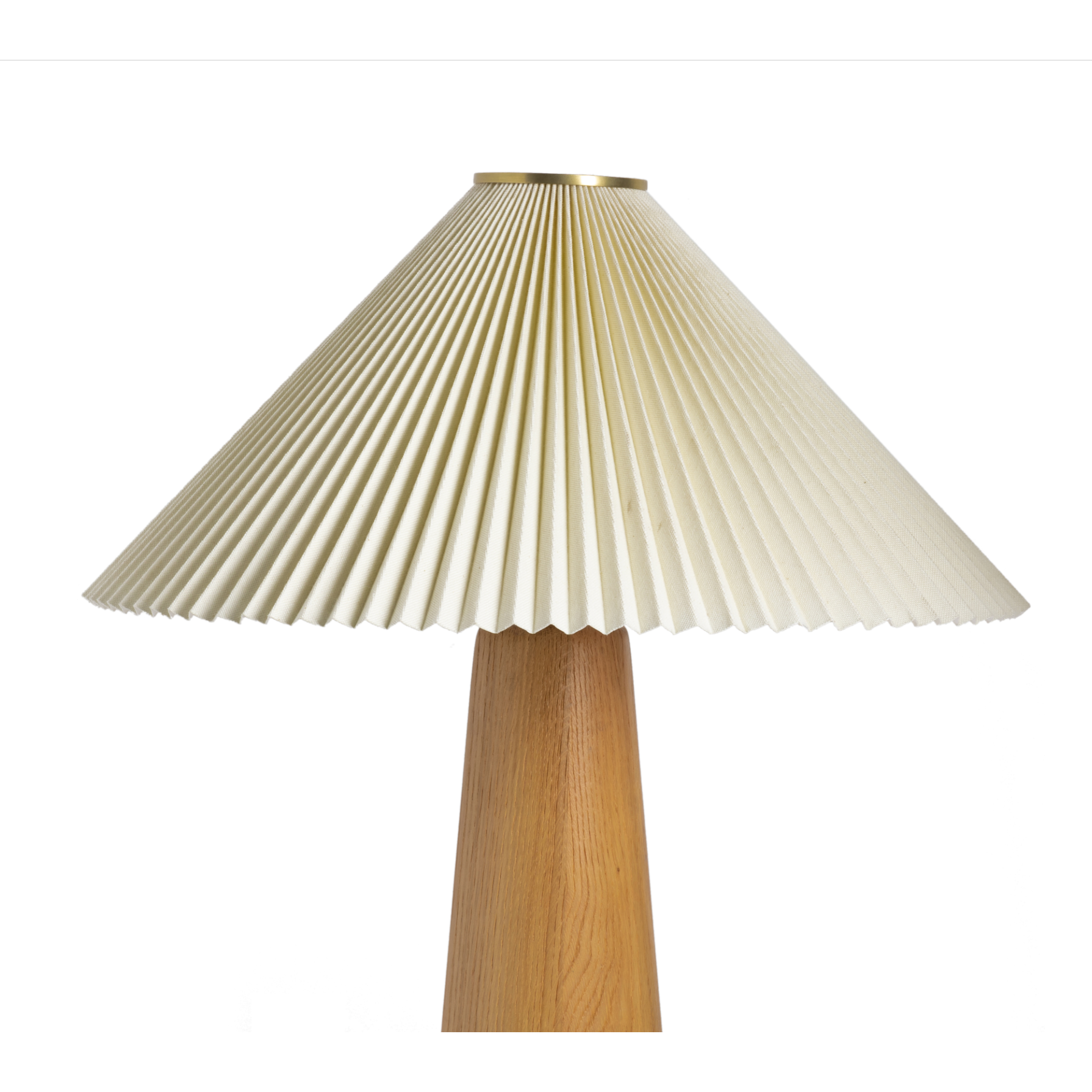 Modern minimal meets traditional. A tapered wood table lamp base is topped with a design-forward pleated shade. Amethyst Home provides interior design, new home construction design consulting, vintage area rugs, and lighting in the Louisville metro area.