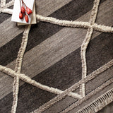 Bring a touch of global-inspired sophistication to your living space with the Cadiz Handmade Rug. This hand knotted wool rug has a plush pile, offering an inviting feel underfoot. The fringe detail adds texture and visual interest, while its Moroccan-style pattern gives this piece a timeless yet modern look. Amethyst Home provides interior design, new home construction design consulting, vintage area rugs, and lighting in the Laguna Beach metro area.