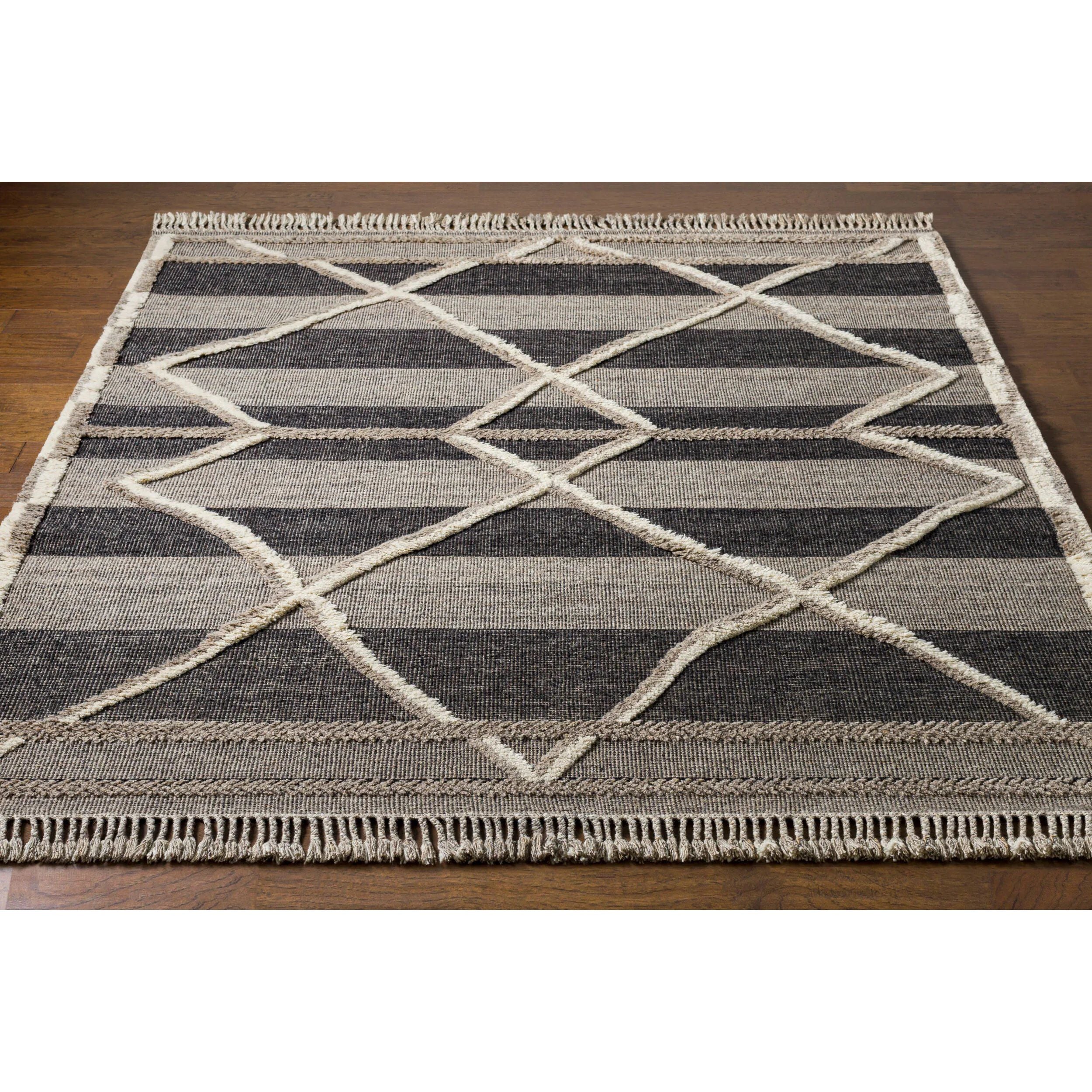 Bring a touch of global-inspired sophistication to your living space with the Cadiz Handmade Rug. This hand knotted wool rug has a plush pile, offering an inviting feel underfoot. The fringe detail adds texture and visual interest, while its Moroccan-style pattern gives this piece a timeless yet modern look. Amethyst Home provides interior design, new home construction design consulting, vintage area rugs, and lighting in the Monterey metro area.
