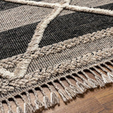 Bring a touch of global-inspired sophistication to your living space with the Cadiz Handmade Rug. This hand knotted wool rug has a plush pile, offering an inviting feel underfoot. The fringe detail adds texture and visual interest, while its Moroccan-style pattern gives this piece a timeless yet modern look. Amethyst Home provides interior design, new home construction design consulting, vintage area rugs, and lighting in the Newport Beach metro area.