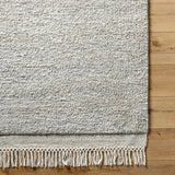 Introducing the Mabel Collection, where Country Cottage meets chic comfort. This handmade rug boasts a high pile construction, hand-woven from pure wool in the heartland of India, ensuring a plush and comfortable surface to walk on. It comes with an appealing fringe detail that adds a touch of rustic charm to any room. Amethyst Home provides interior design, new home construction design consulting, vintage area rugs, and lighting in the San Diego metro area.