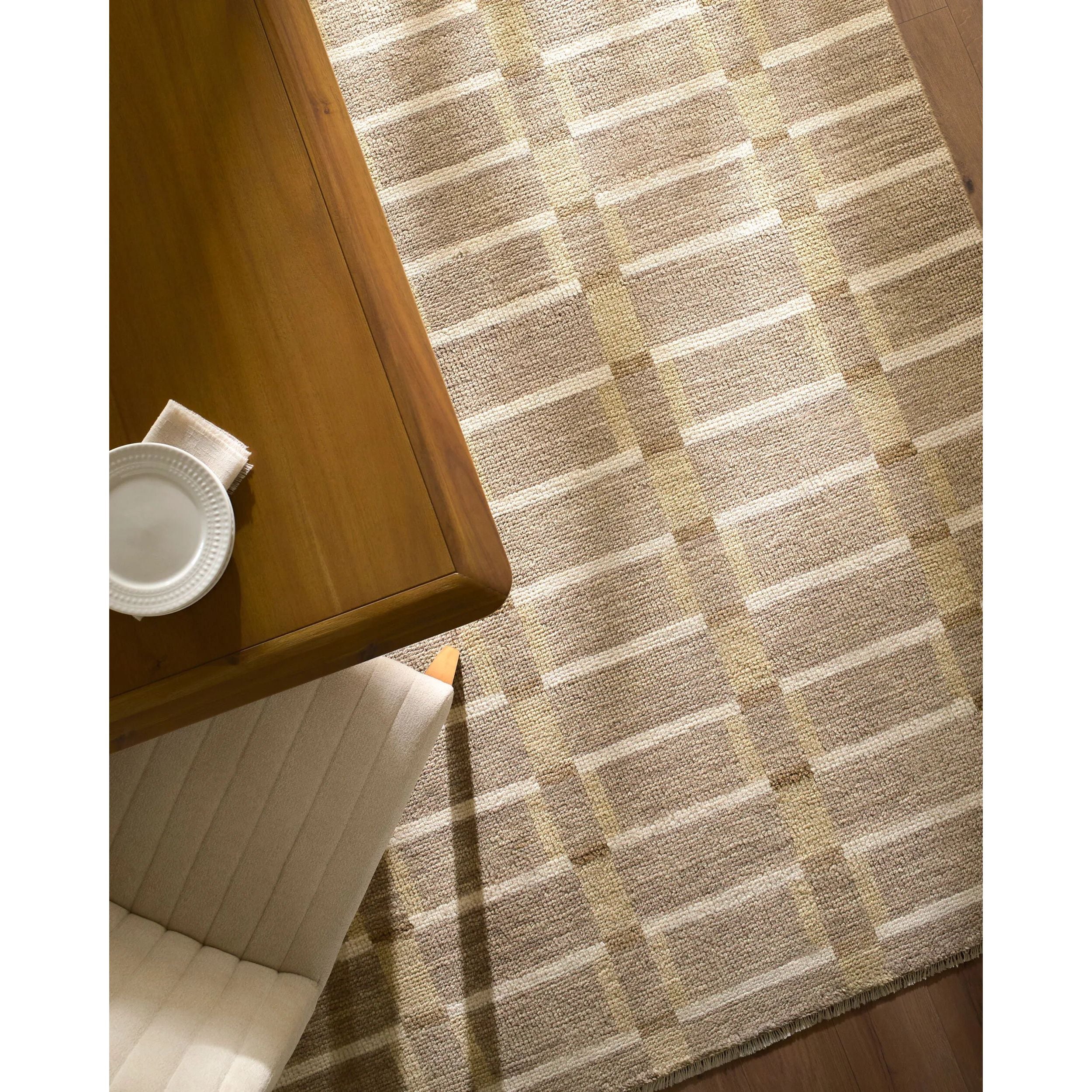 Transform your living space into a vibrant sanctuary with the Riviera handmade rug, a stunning embodiment of Bohemian Global style. This exquisite piece, hand-knotted in India, combines the plush comfort of New Zealand wool with the natural durability of cotton, creating a low-pile masterpiece that's both cozy and resilient. Amethyst Home provides interior design, new home construction design consulting, vintage area rugs, and lighting in the Alpharetta metro area.