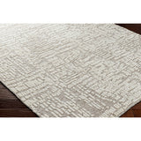 Introducing the Tunus Aubrey rug, hand-knotted from 100% wool and woven into an abstract, geometric pattern. Featuring taupe and ivory colors, this stylish and warm rug brings modern sophistication to any space. Amethyst Home provides interior design, new home construction design consulting, vintage area rugs, and lighting in the Denver metro area.