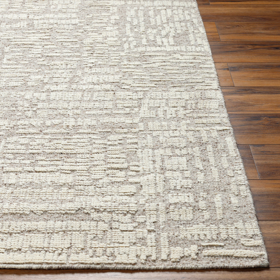 Introducing the Tunus Aubrey rug, hand-knotted from 100% wool and woven into an abstract, geometric pattern. Featuring taupe and ivory colors, this stylish and warm rug brings modern sophistication to any space. Amethyst Home provides interior design, new home construction design consulting, vintage area rugs, and lighting in the Omaha metro area.