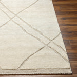 The Tunus Cream Rug features a globally inspired design made from wool. The hand-knotted rug adds wabi sabi charm to any room. Amethyst Home provides interior design, new home construction design consulting, vintage area rugs, and lighting in the Omaha metro area.
