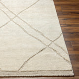 The Tunus Cream Rug features a globally inspired design made from wool. The hand-knotted rug adds wabi sabi charm to any room. Amethyst Home provides interior design, new home construction design consulting, vintage area rugs, and lighting in the Omaha metro area.